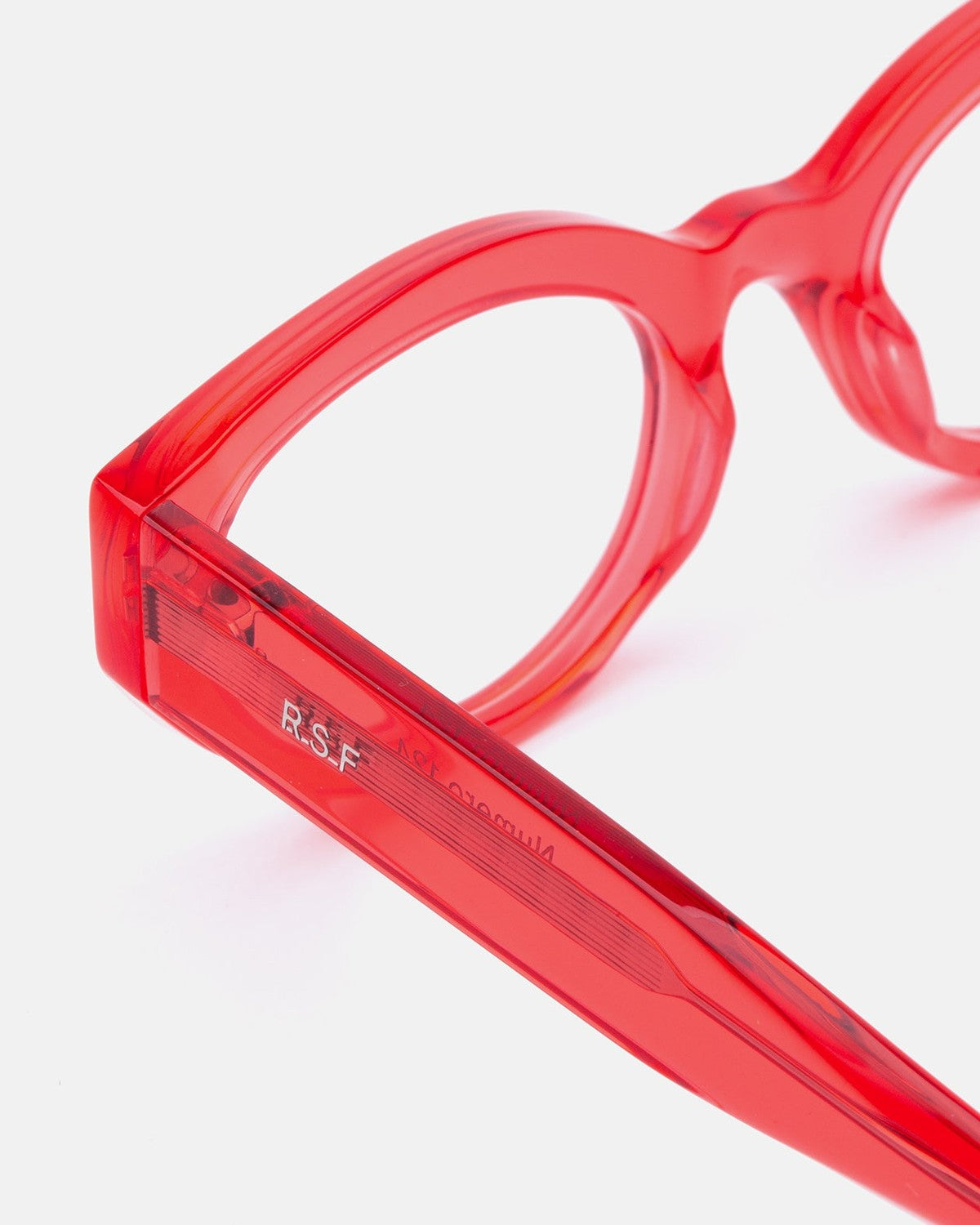 Close-up of the temple and hinge on RETROSUPERFUTURE Numero 124 Light Red sunglasses.
