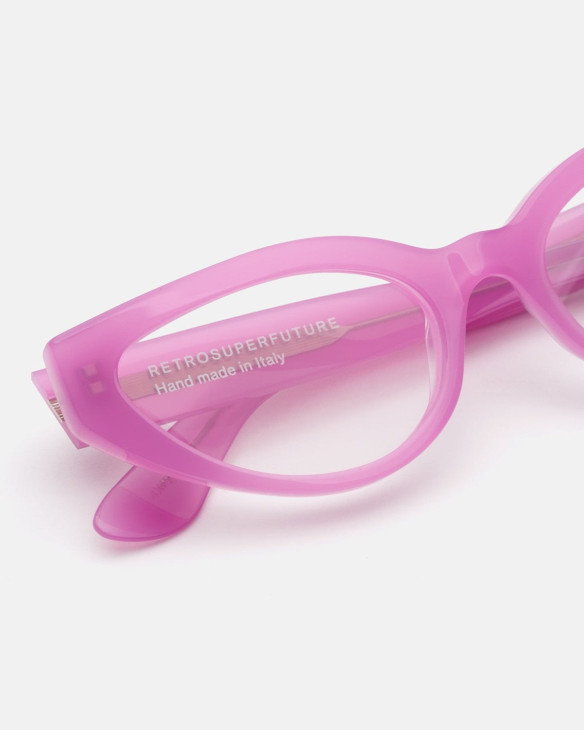 Close-up of the temple and hinge on RETROSUPERFUTURE Numero 124 Pink sunglasses.