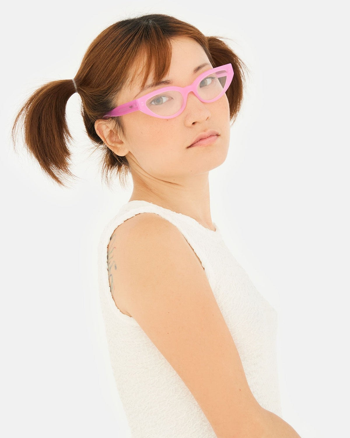Model wearing RETROSUPERFUTURE Numero 124 Pink sunglasses, angled view.