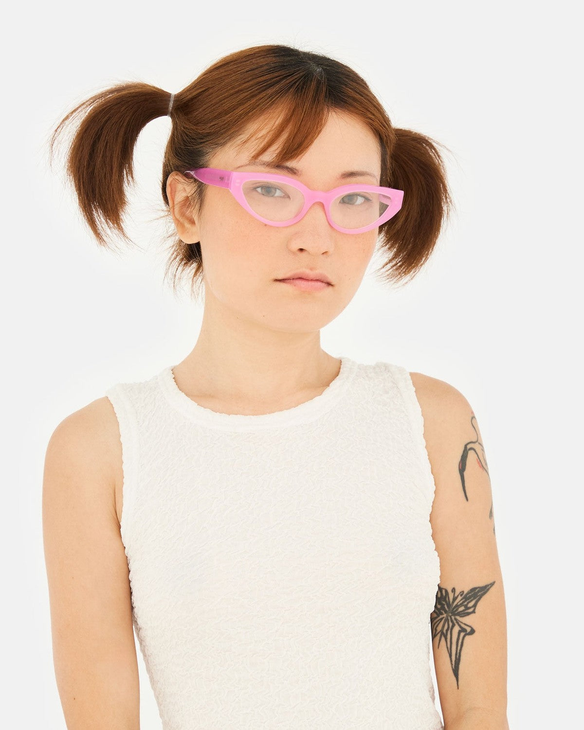 Model wearing RETROSUPERFUTURE Numero 124 Pink sunglasses, front view.