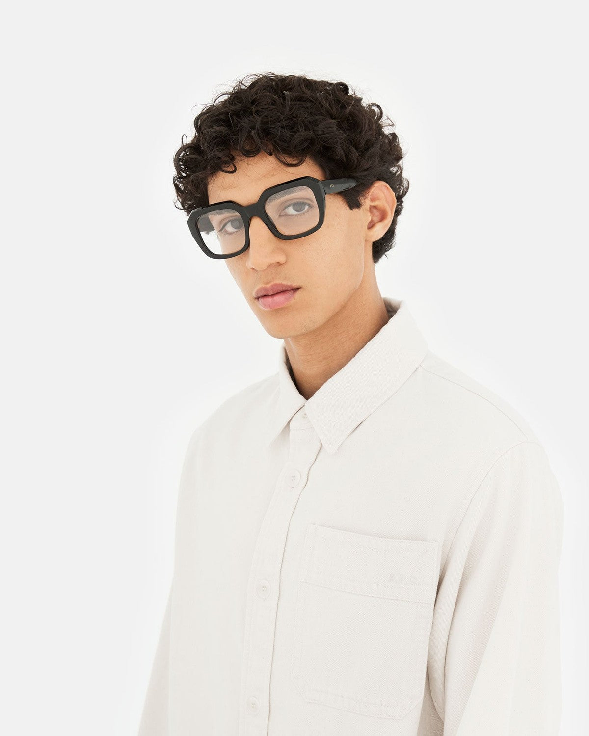 Model wearing RETROSUPERFUTURE Numero 125 Black sunglasses facing forward.