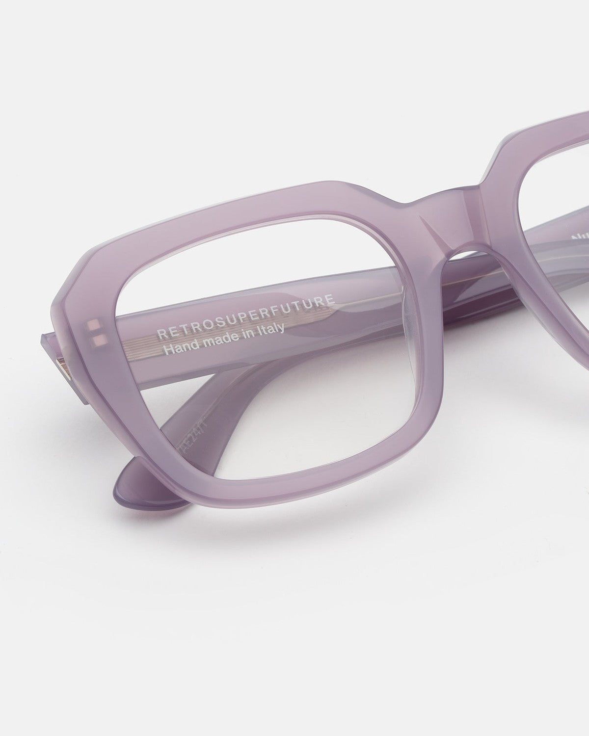 Close-up of the temple branding on RETROSUPERFUTURE Numero 125 Light Purple sunglasses.