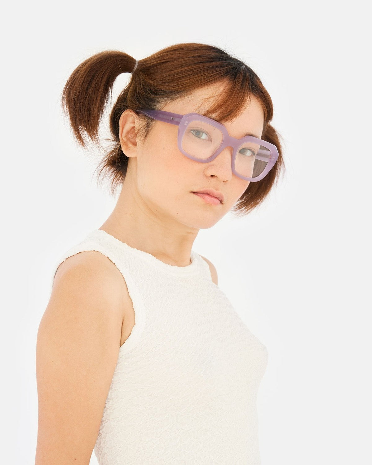 Model wearing RETROSUPERFUTURE Numero 125 Light Purple sunglasses in three-quarter view.