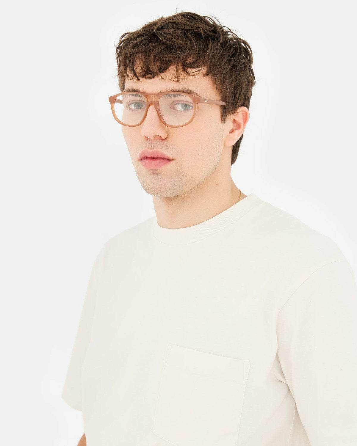 Male model wearing RETROSUPERFUTURE Numero 127 Cola sunglasses.