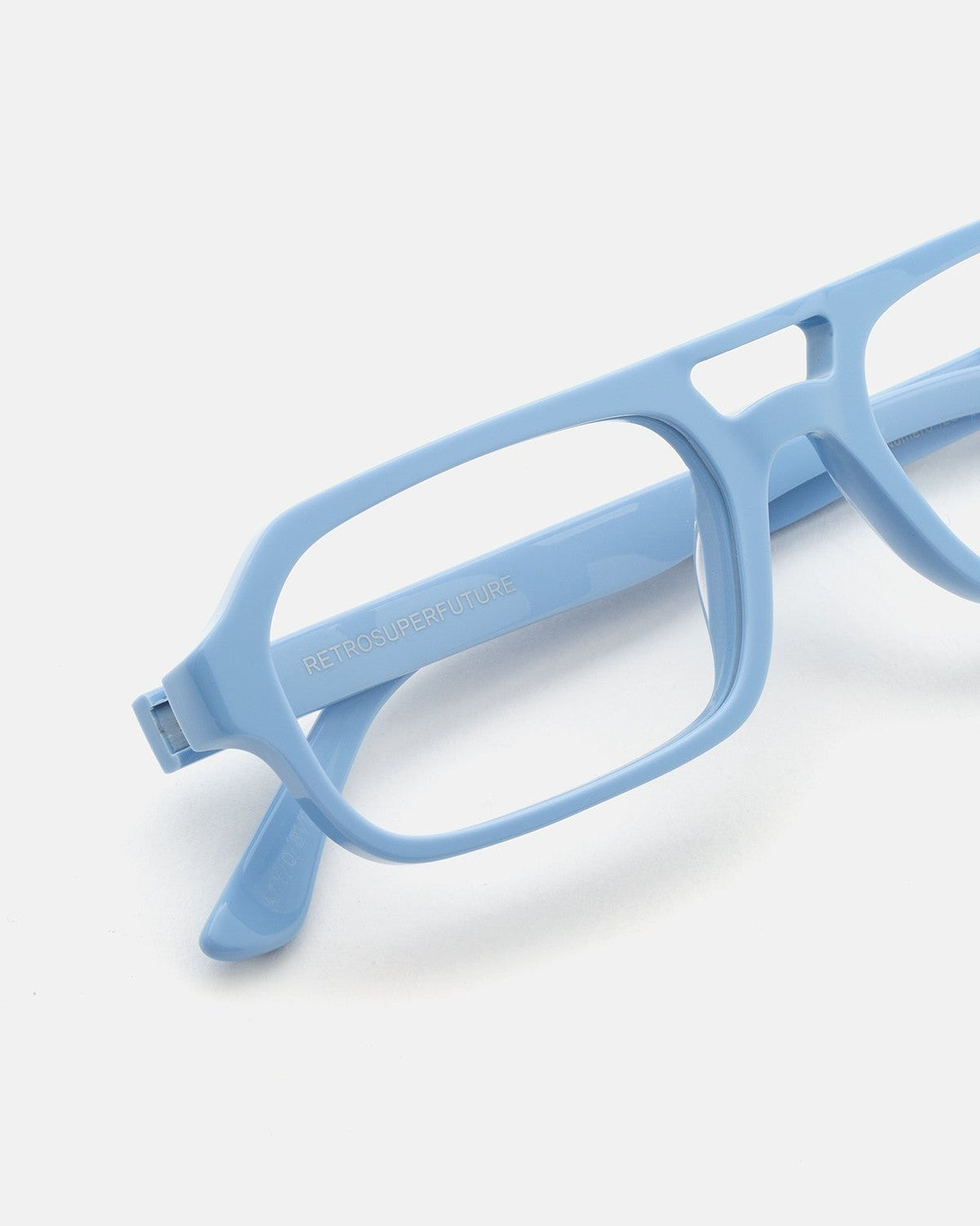 Close-up of the temple and hinge detail on RETROSUPERFUTURE Numero 128 Azzurro sunglasses.