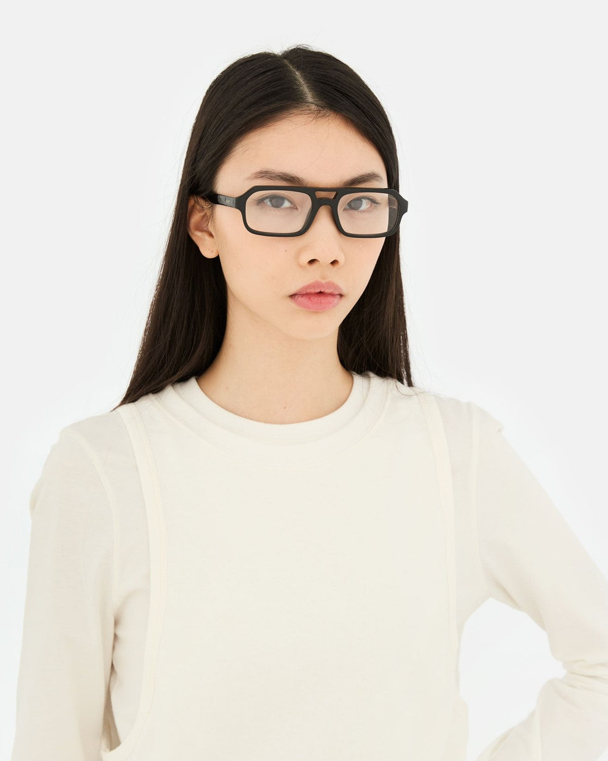Model wearing RETROSUPERFUTURE Numero 128 Black sunglasses.