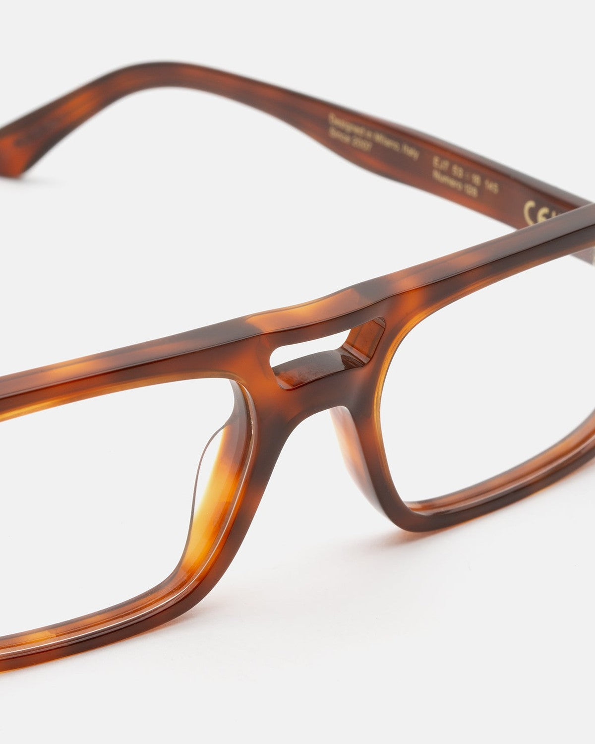 Detail of the bridge and temple on RETROSUPERFUTURE Numero 128 Havana Diversa sunglasses.