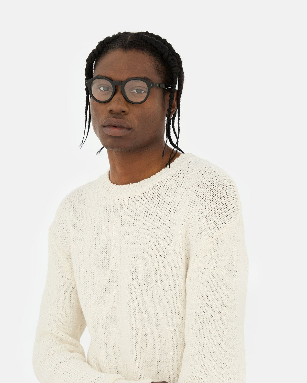 Model wearing RETROSUPERFUTURE Numero 129 Black sunglasses.