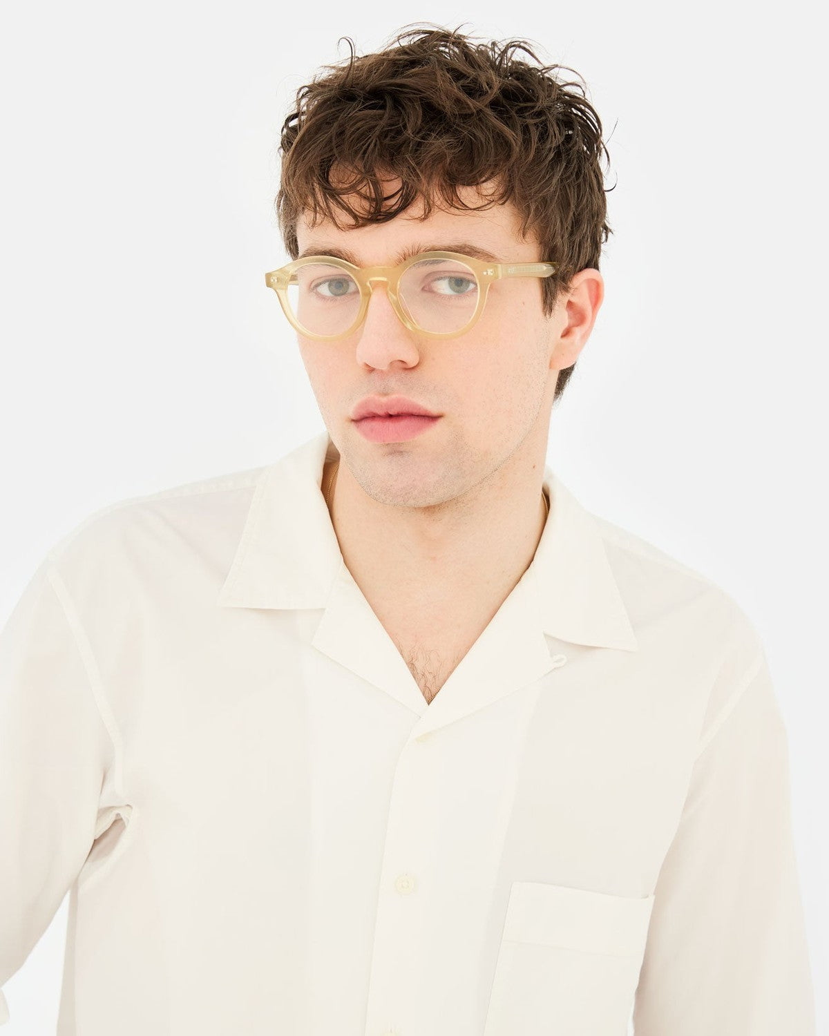 Model wearing RETROSUPERFUTURE Numero 129 Cozy sunglasses with a cream shirt.