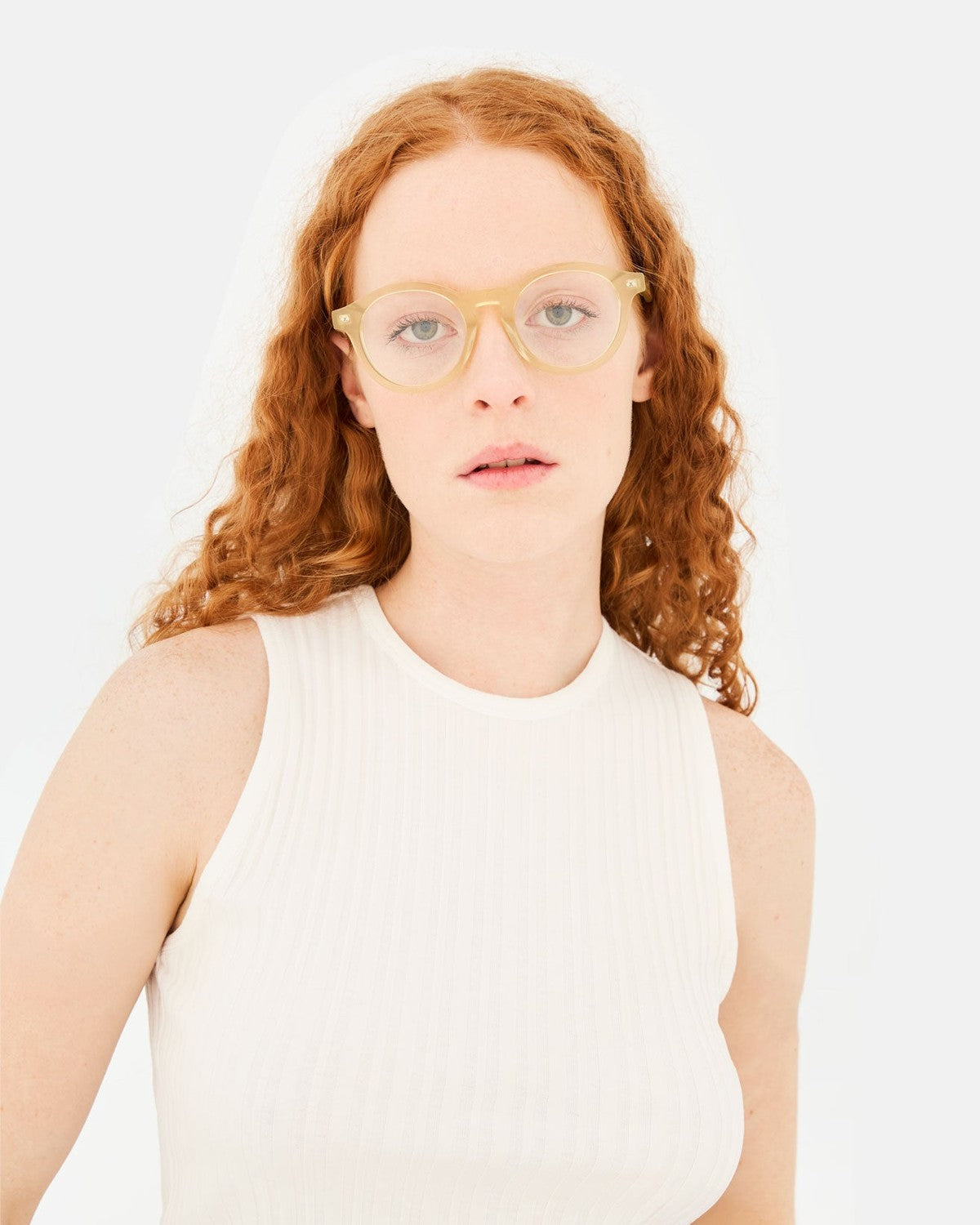 Model wearing RETROSUPERFUTURE Numero 129 Cozy sunglasses with a white ribbed top.