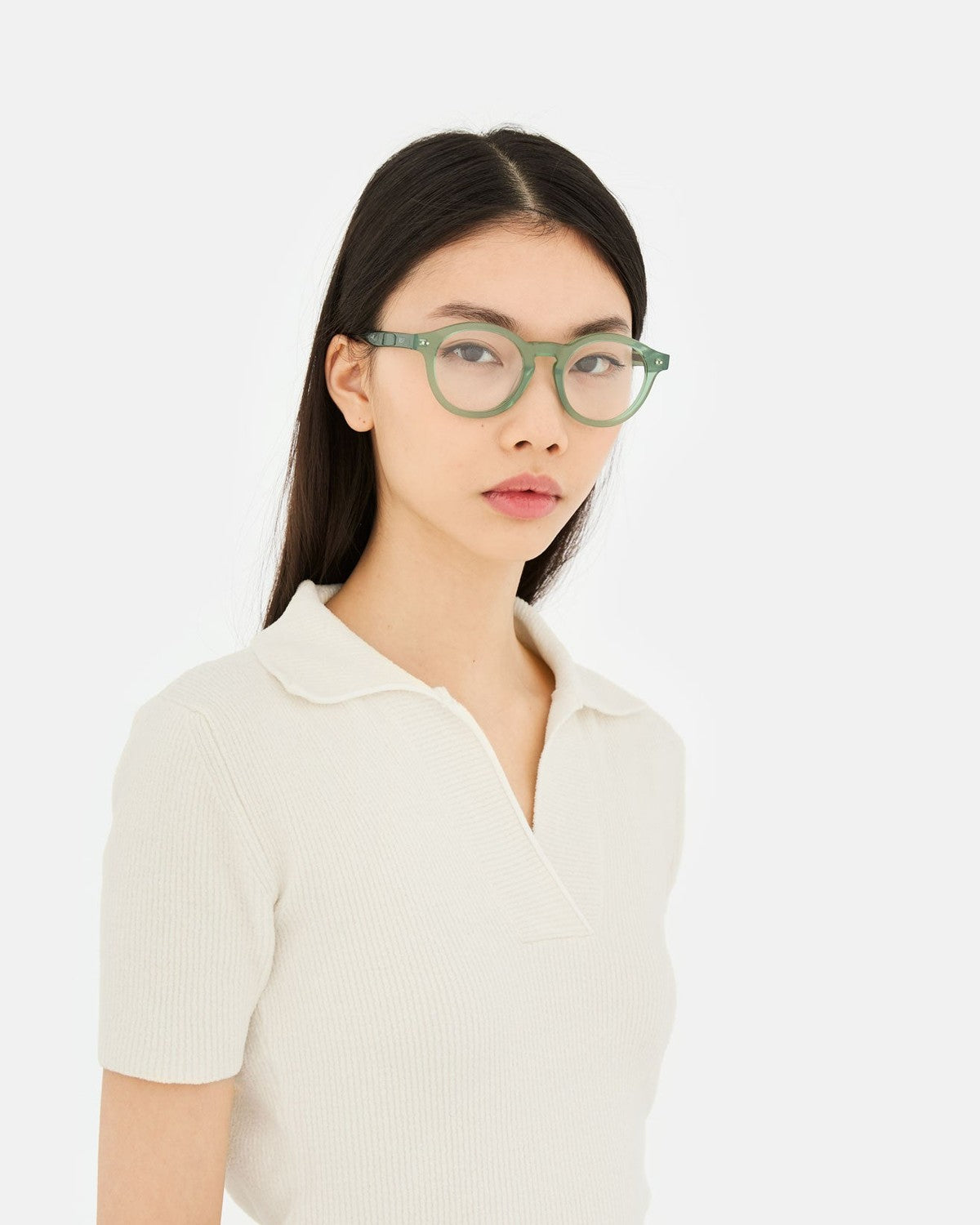 Model wearing RETROSUPERFUTURE Numero 129 Salvia sunglasses.