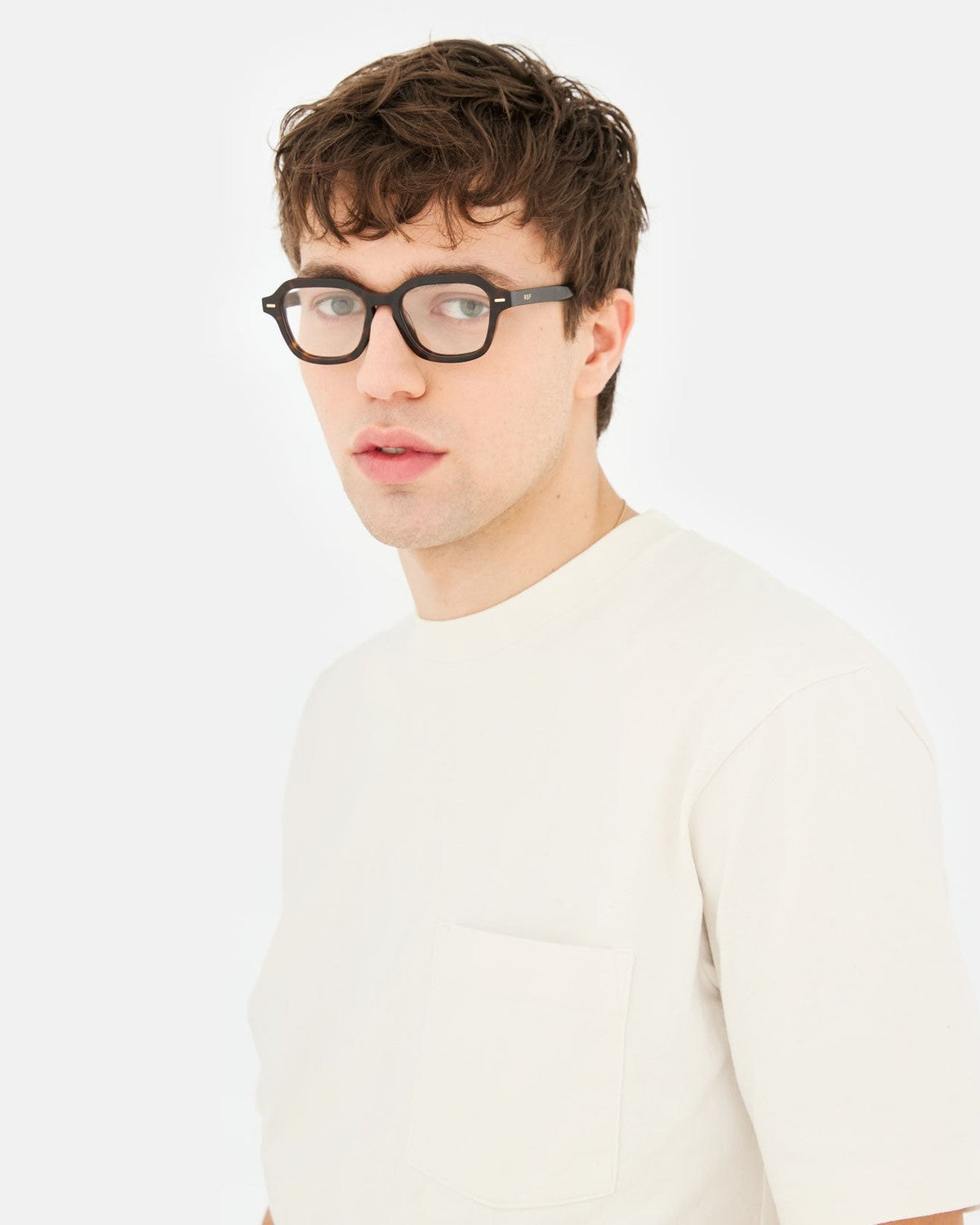 Model wearing RETROSUPERFUTURE Numero 130 Havana sunglasses, angled view.