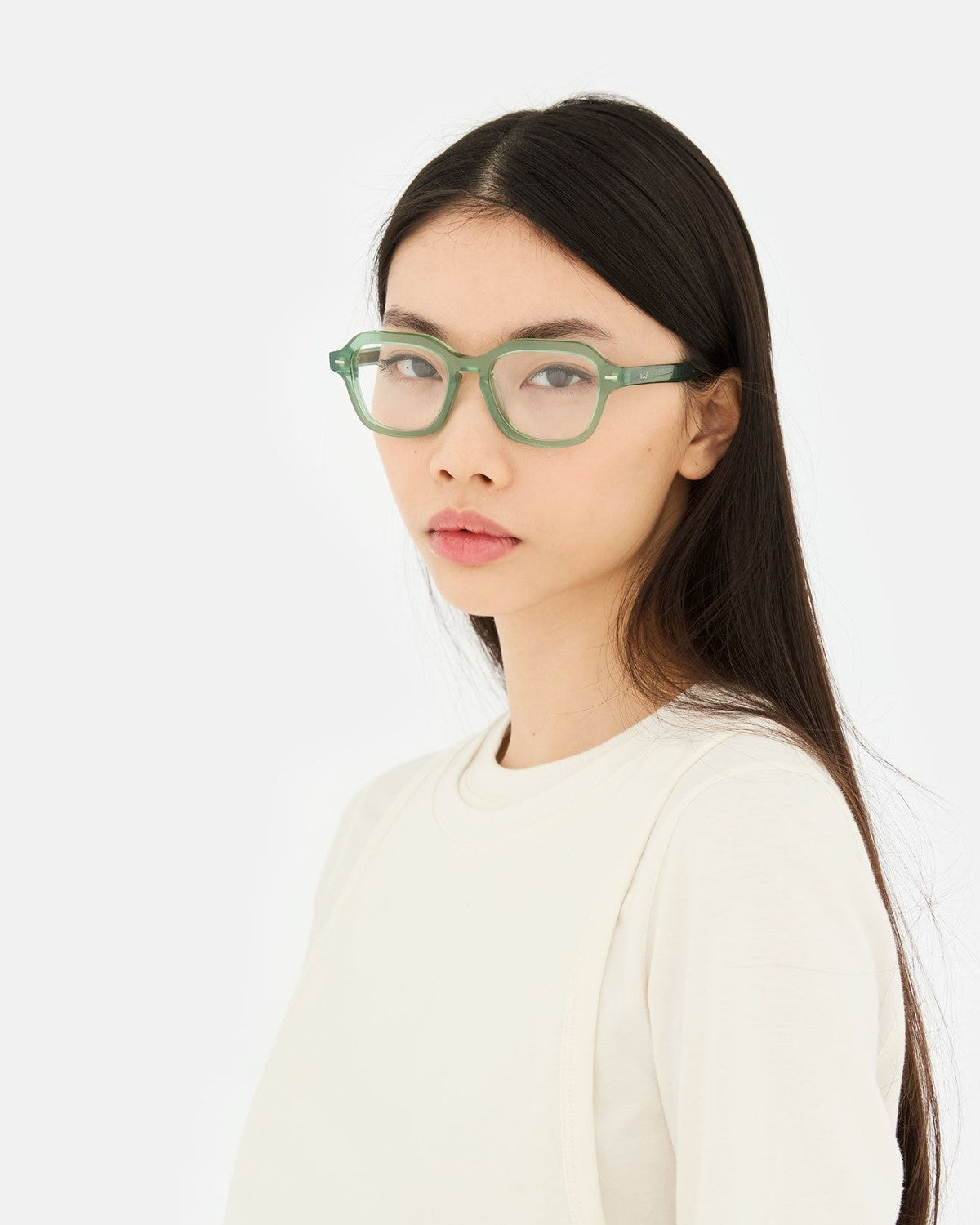 Model wearing RETROSUPERFUTURE Numero 130 Salvia sunglasses, side view.