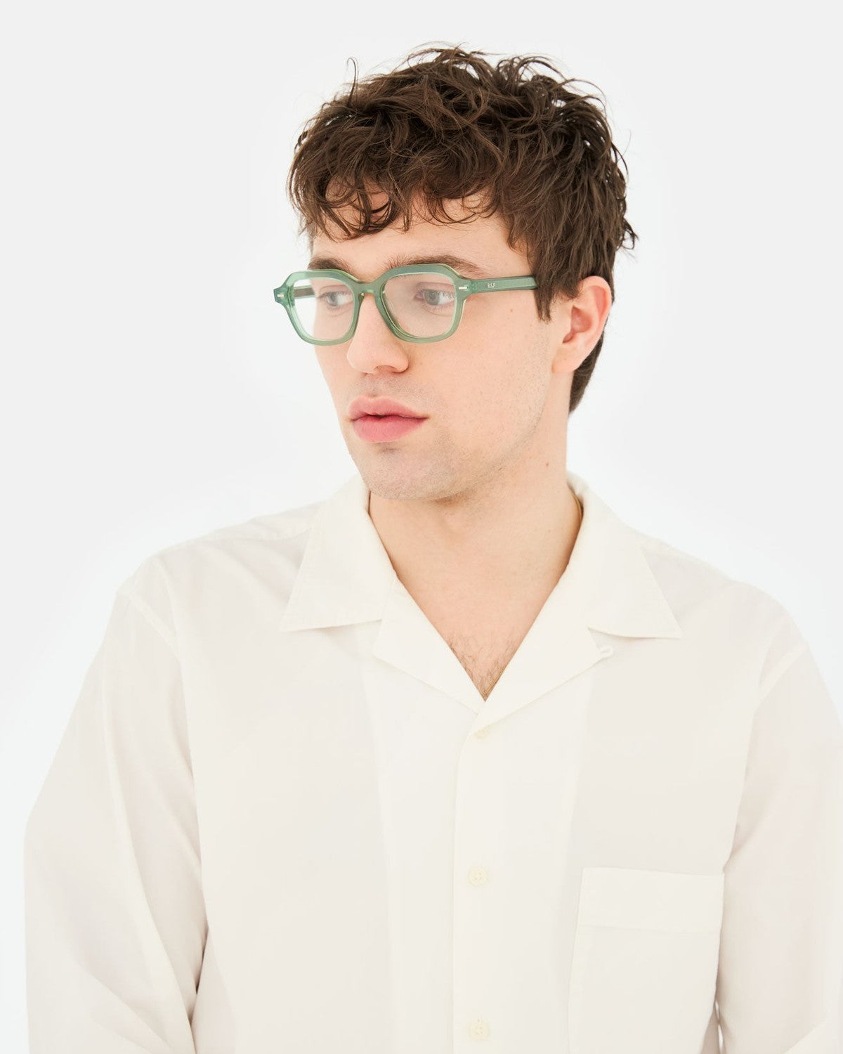 Model wearing RETROSUPERFUTURE Numero 130 Salvia sunglasses, angle view.