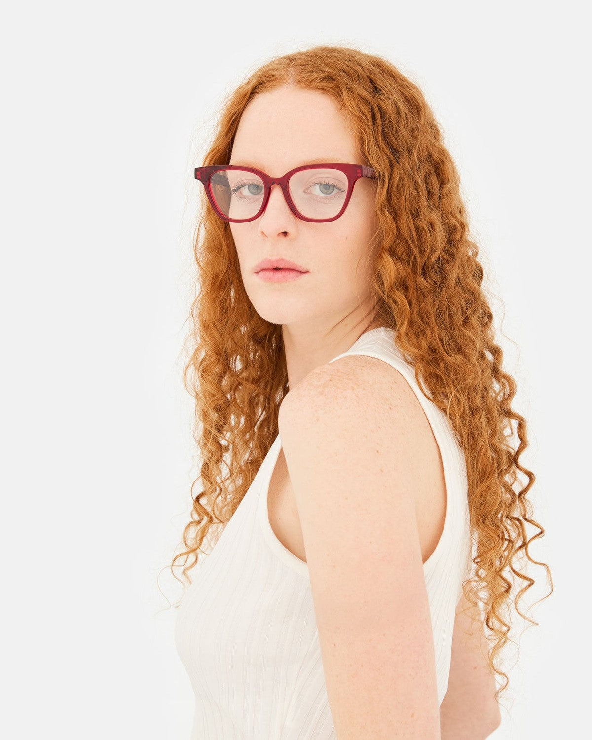 Model wearing RETROSUPERFUTURE Numero 131 Rossissimo sunglasses, angled view.