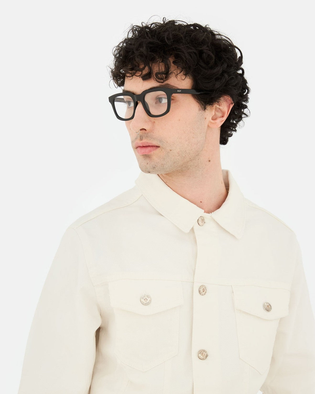 Model wearing RETROSUPERFUTURE Numero 132 Black sunglasses with cream shirt.
