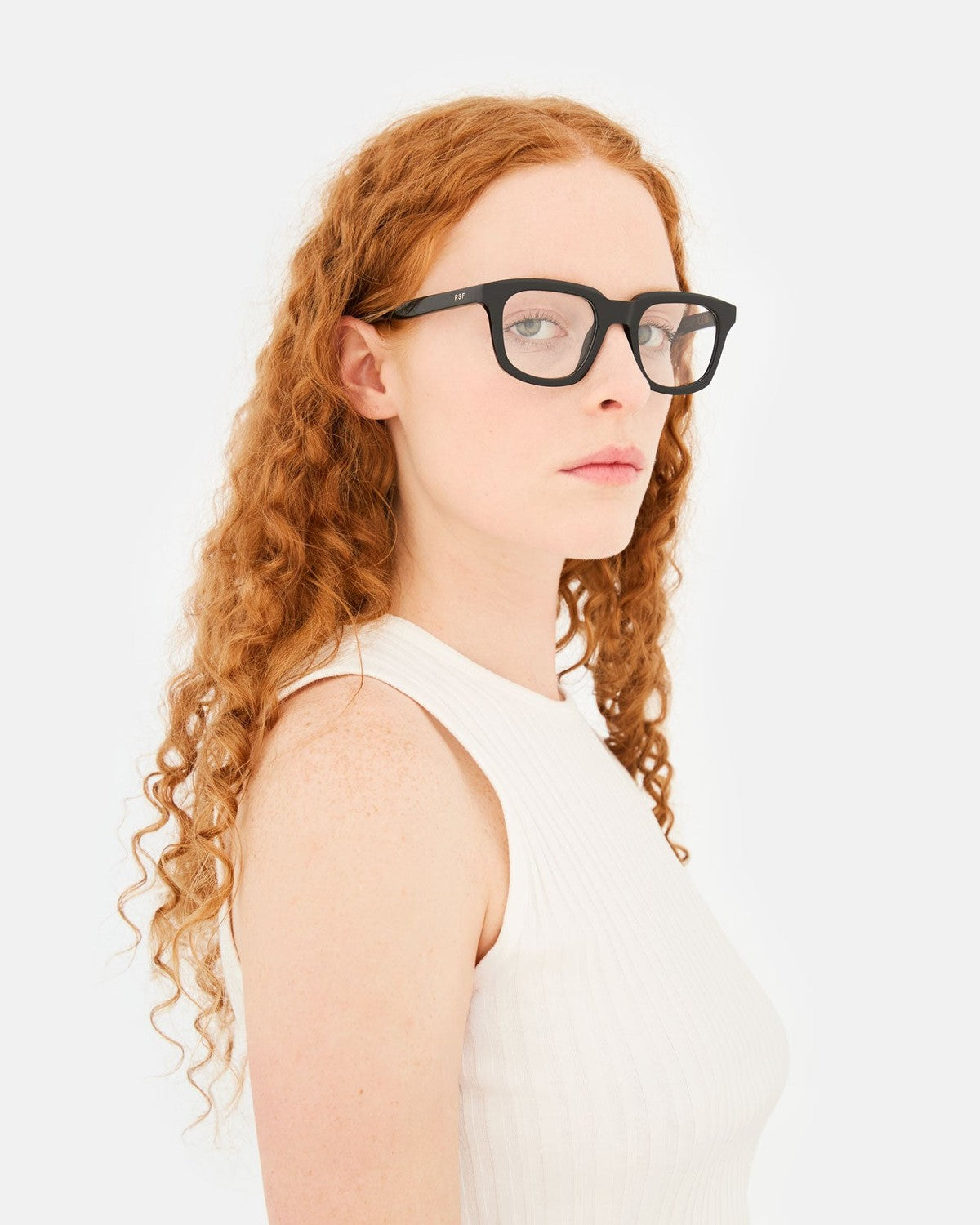 Side profile of model wearing RETROSUPERFUTURE Numero 132 Black sunglasses.