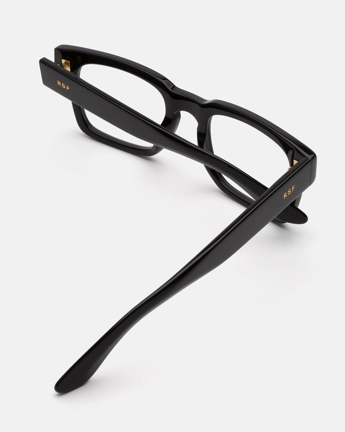 Tilted overhead view of RETROSUPERFUTURE Numero 133 Black sunglasses showing the temples.