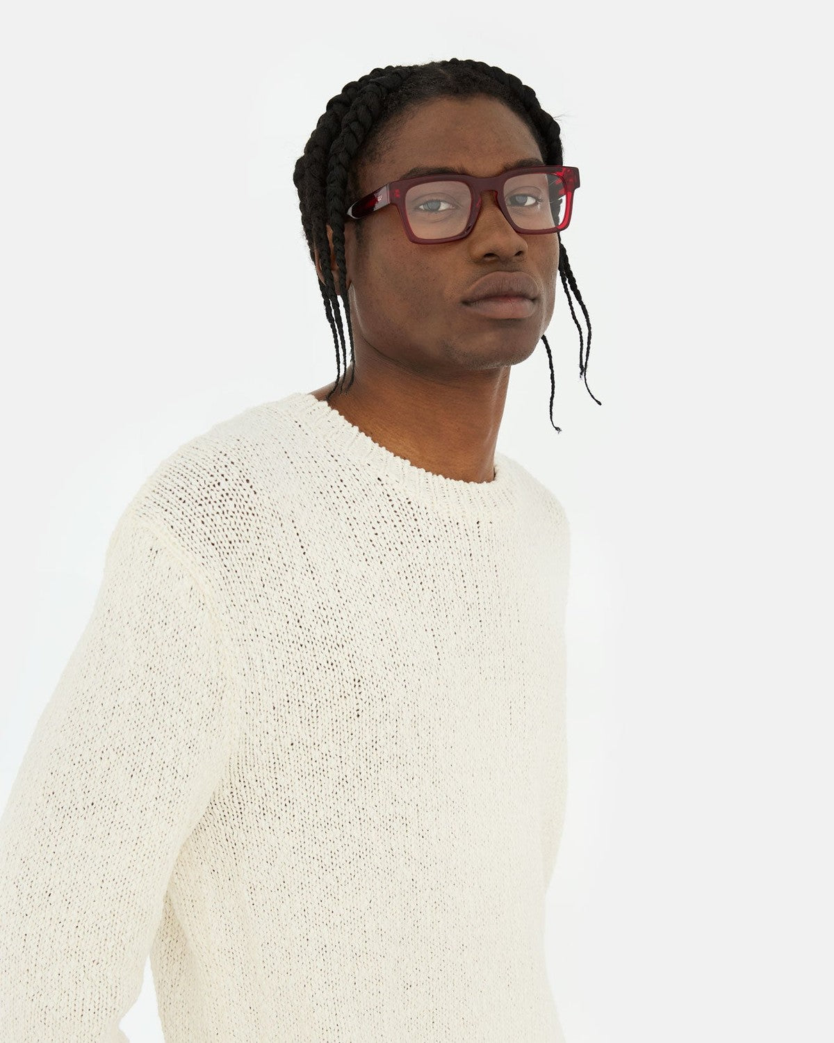 Model wearing RETROSUPERFUTURE Numero 133 Rossissimo sunglasses with cream sweater.