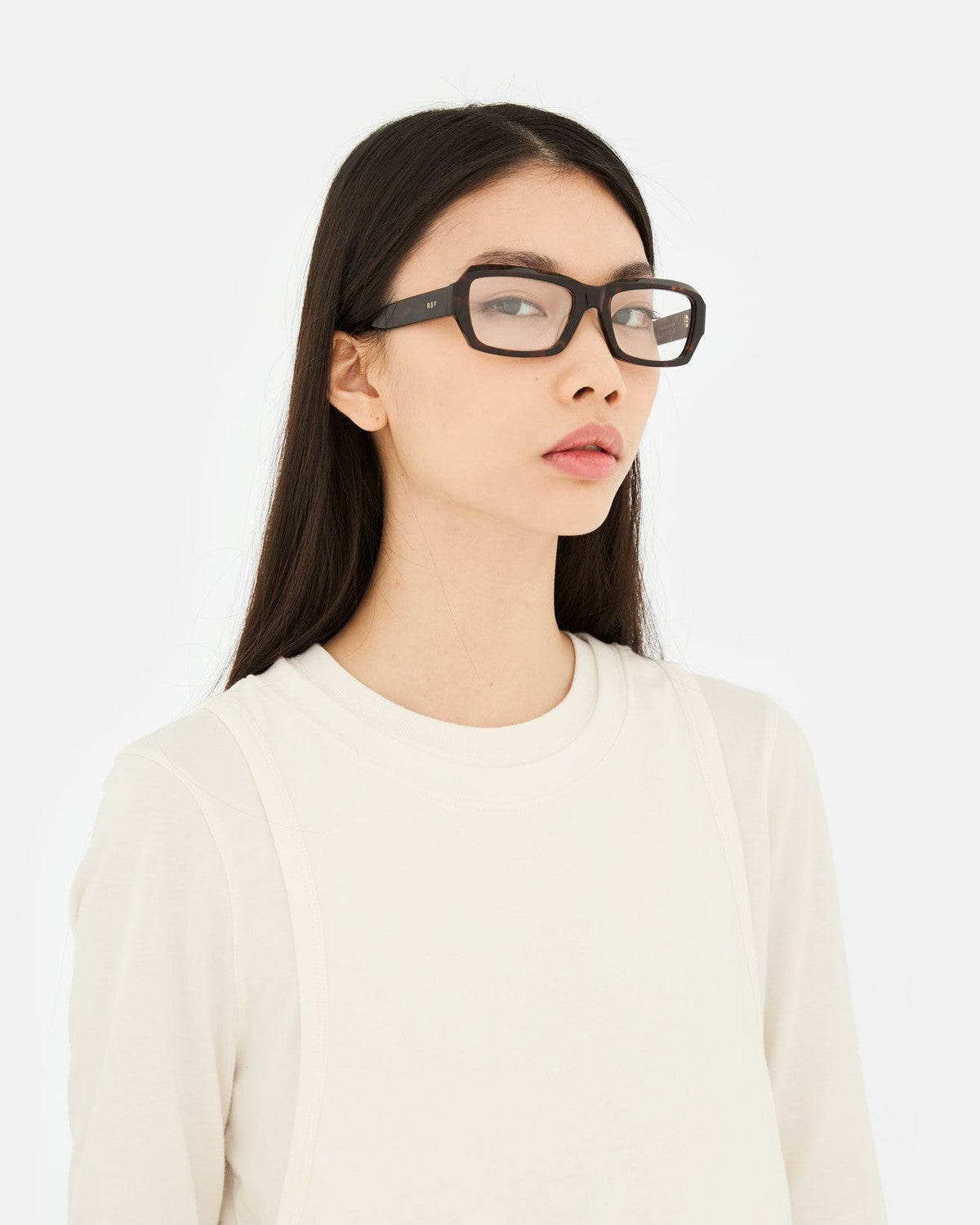 Model wearing RETROSUPERFUTURE Numero 134 3627 sunglasses in three-quarter view.