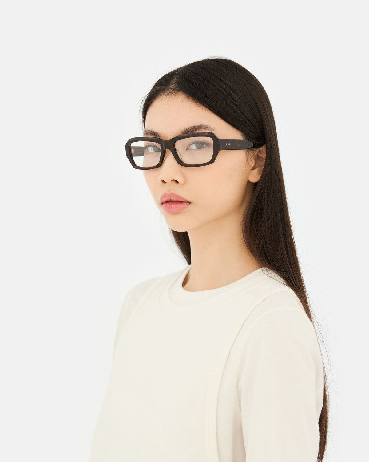 Model wearing RETROSUPERFUTURE Numero 134 3627 sunglasses in side profile.