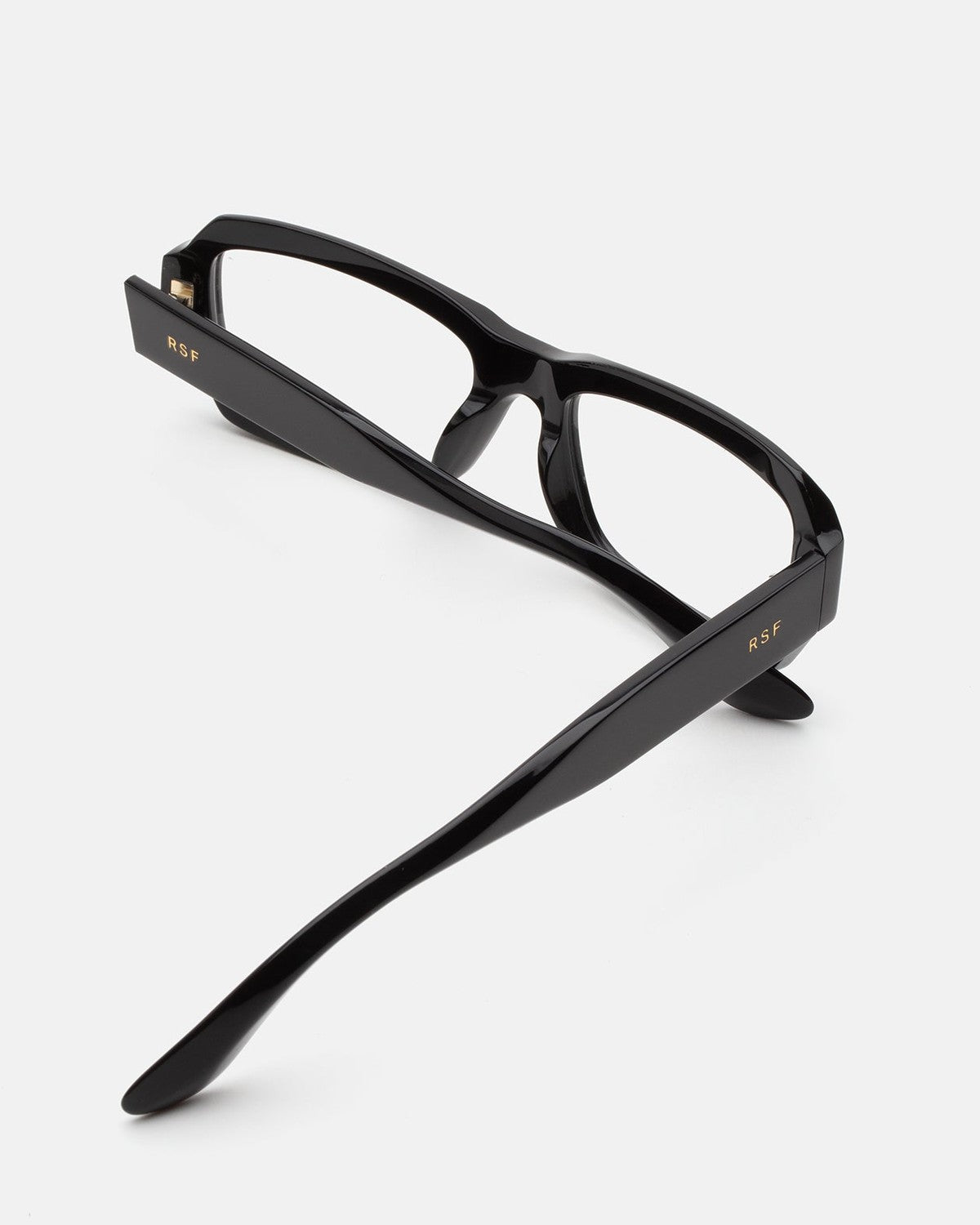 Interior view of RETROSUPERFUTURE Numero 134 Black sunglasses showing temple arms and hinges.