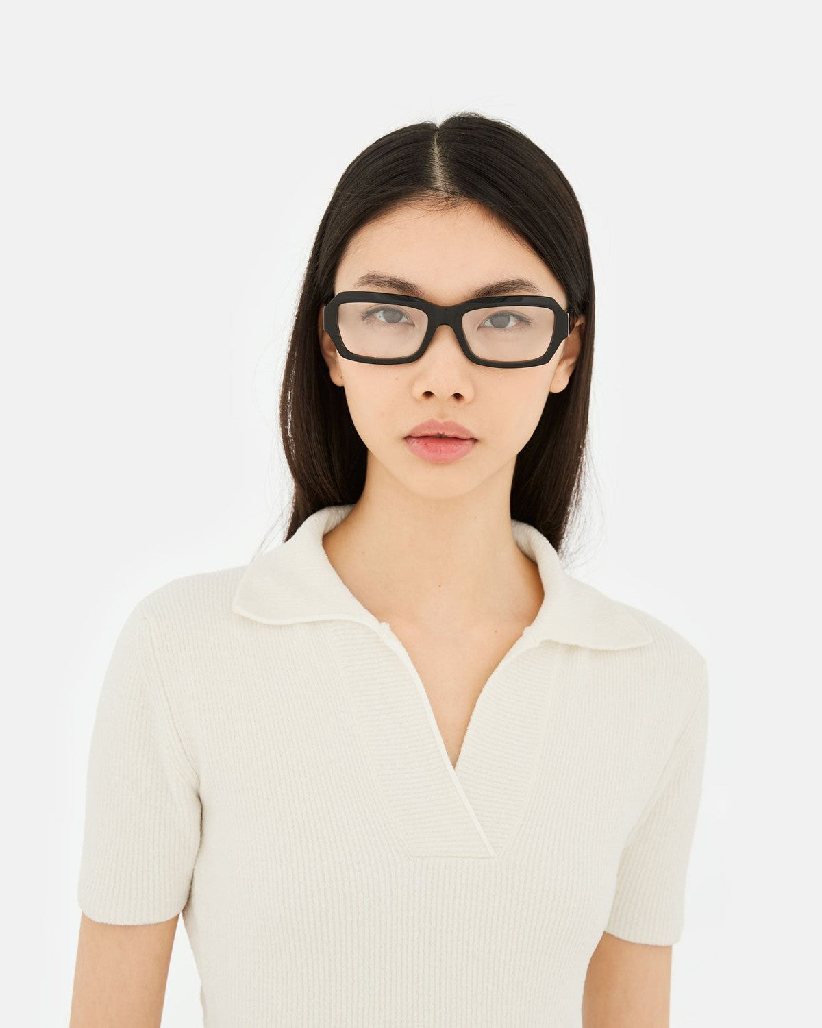 Model wearing RETROSUPERFUTURE Numero 134 Black sunglasses, facing forward.
