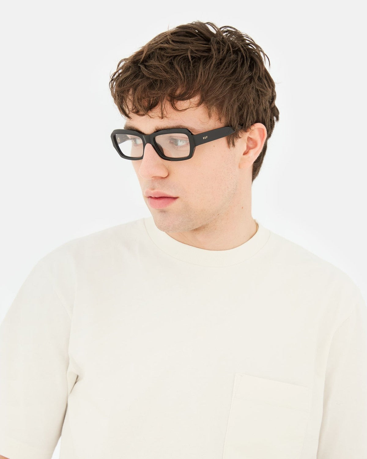 Model wearing RETROSUPERFUTURE Numero 134 Black sunglasses, side profile.