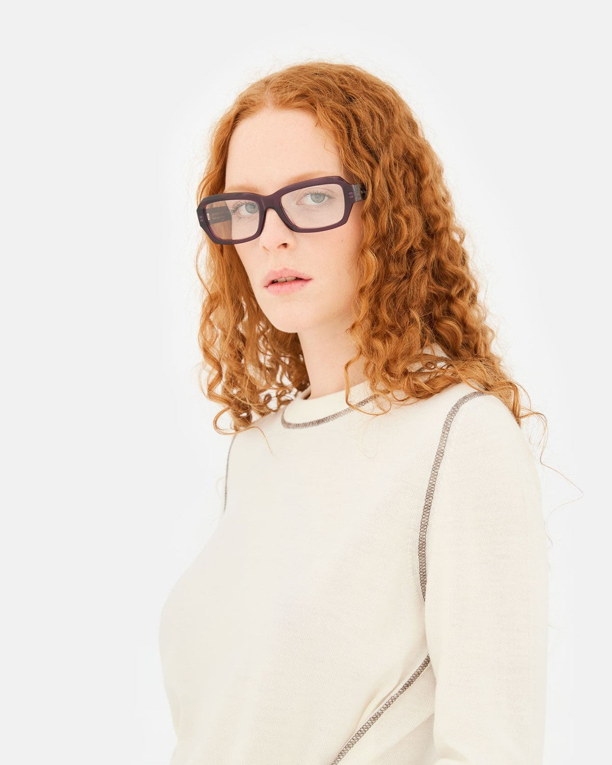 Model wearing RETROSUPERFUTURE Numero 134 Melanzana sunglasses in profile.