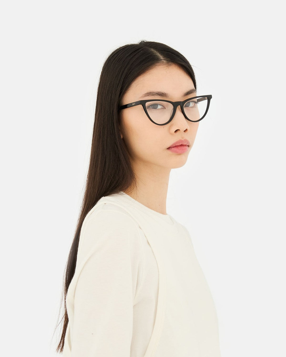 Side profile of model wearing RETROSUPERFUTURE Numero 135 Black sunglasses.