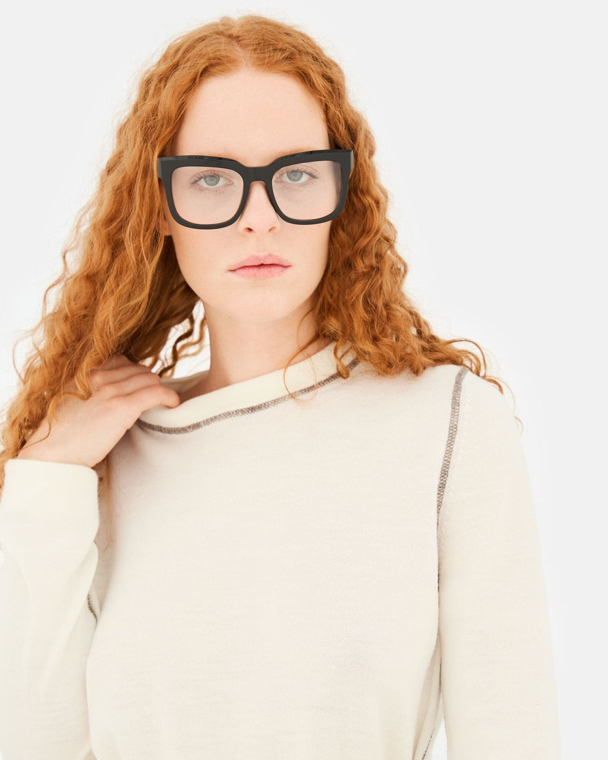 Model wearing RETROSUPERFUTURE Numero 136 Black sunglasses, front facing.