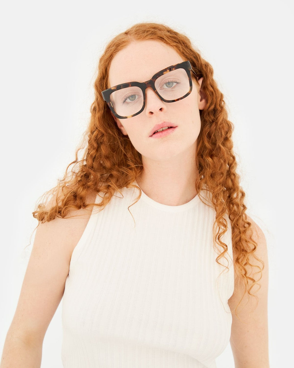 Model wearing RETROSUPERFUTURE Numero 136 Burnt Havana sunglasses, front view.
