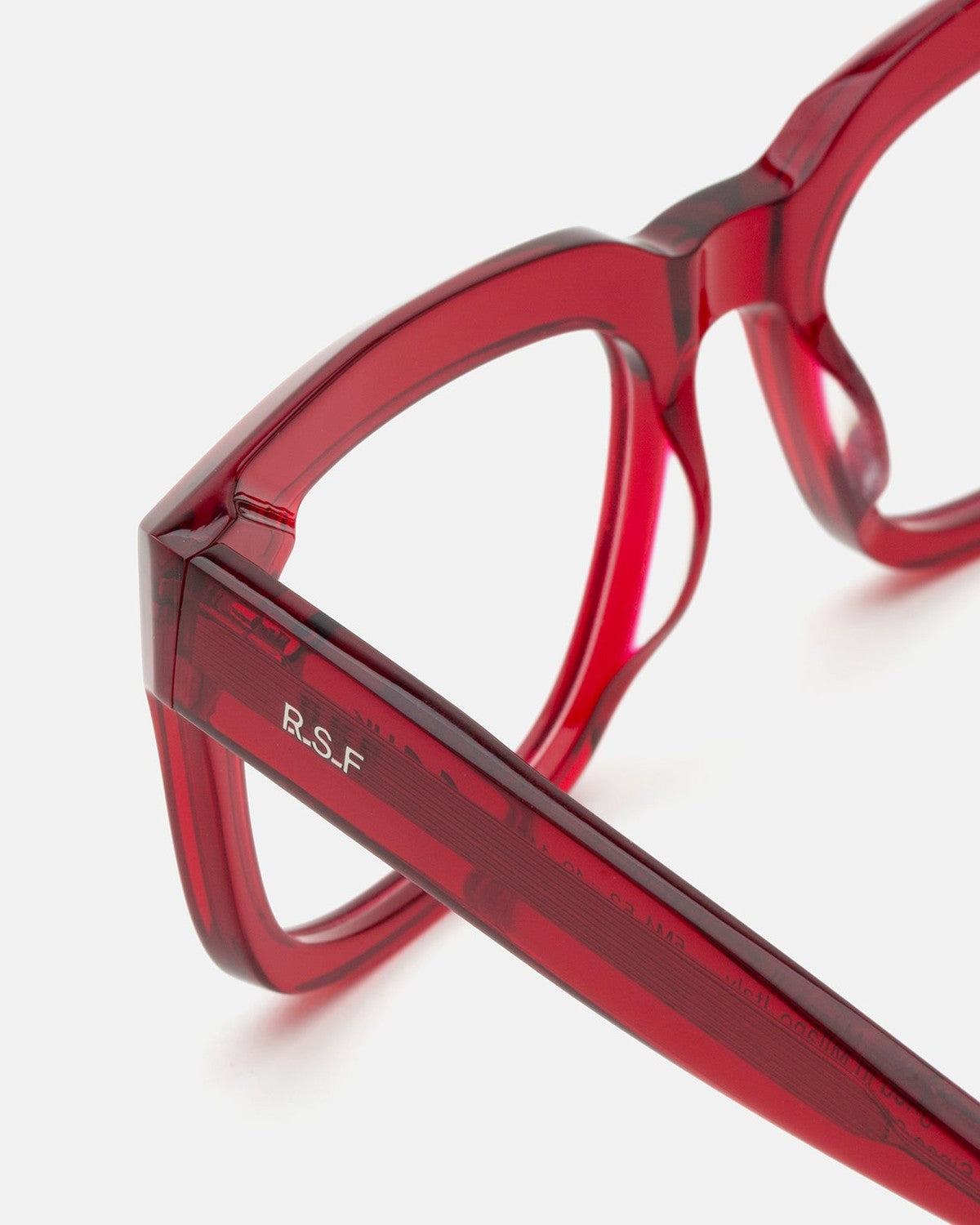 Close-up of the temple and hinge detail on RETROSUPERFUTURE Numero 136 Rossissimo sunglasses.