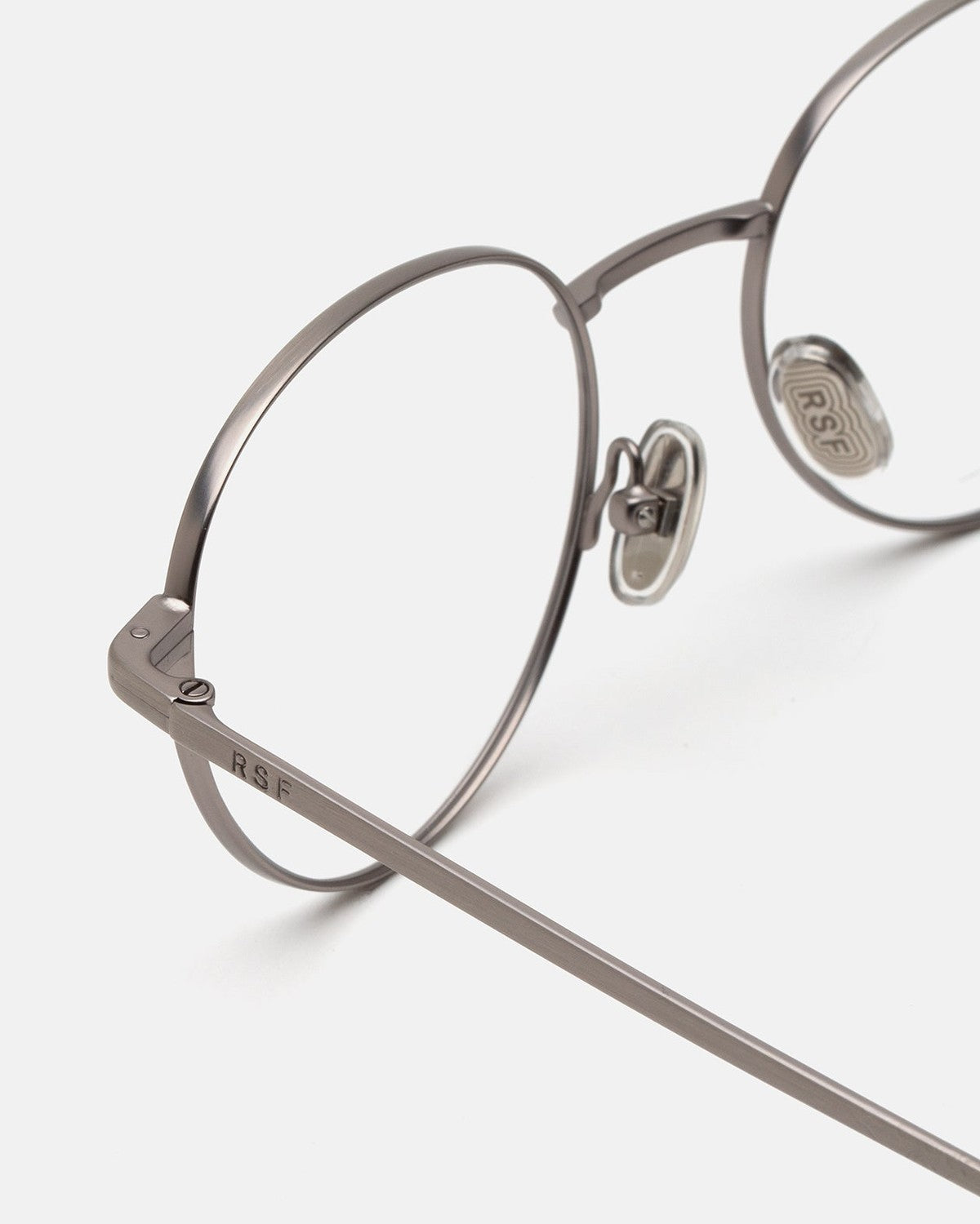 Close-up of the metal frame construction and nose pads on RETROSUPERFUTURE Numero 137 Salvia sunglasses.