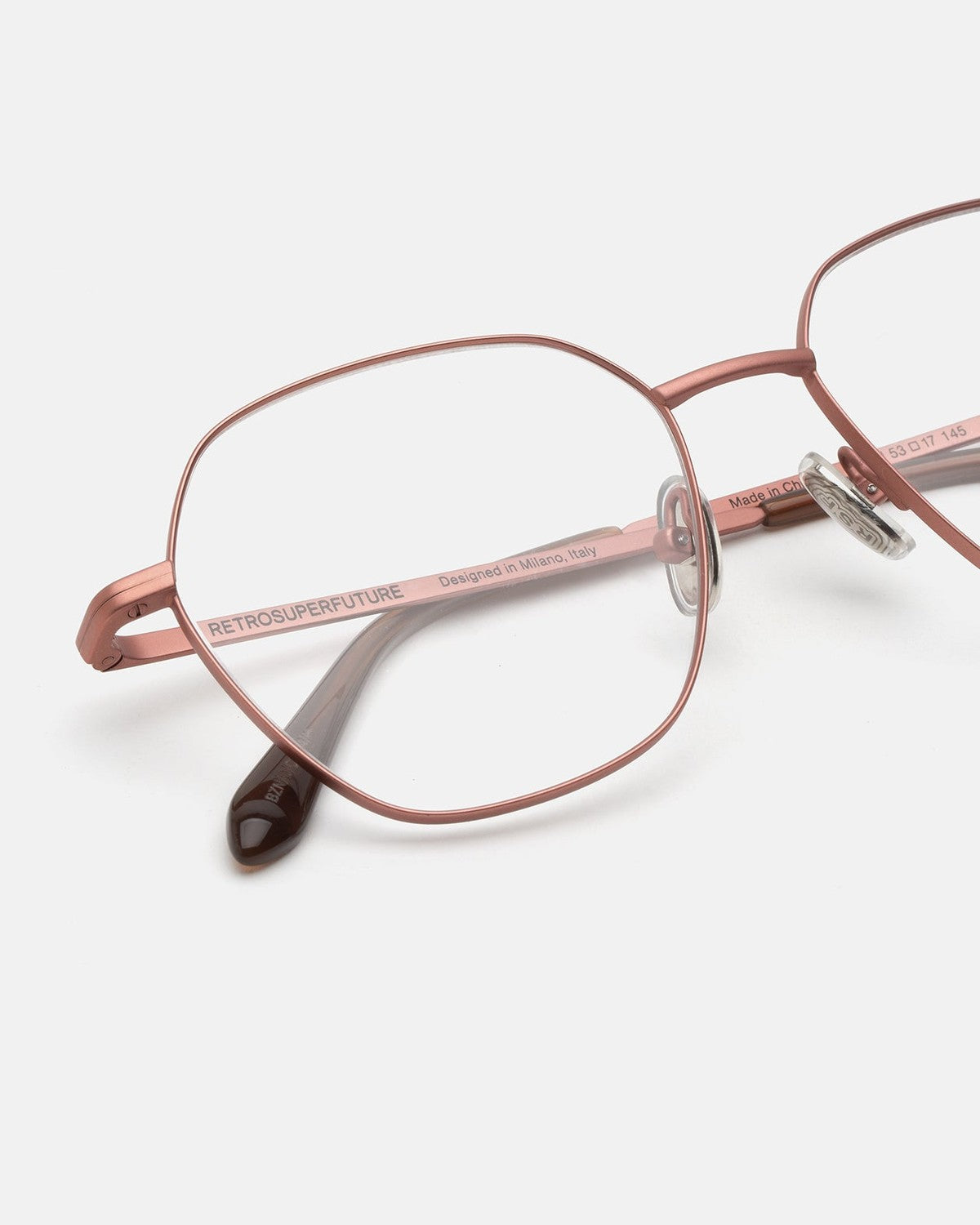 Close-up of the bridge and temple detailing on RETROSUPERFUTURE Numero 138 Dark Brown sunglasses.