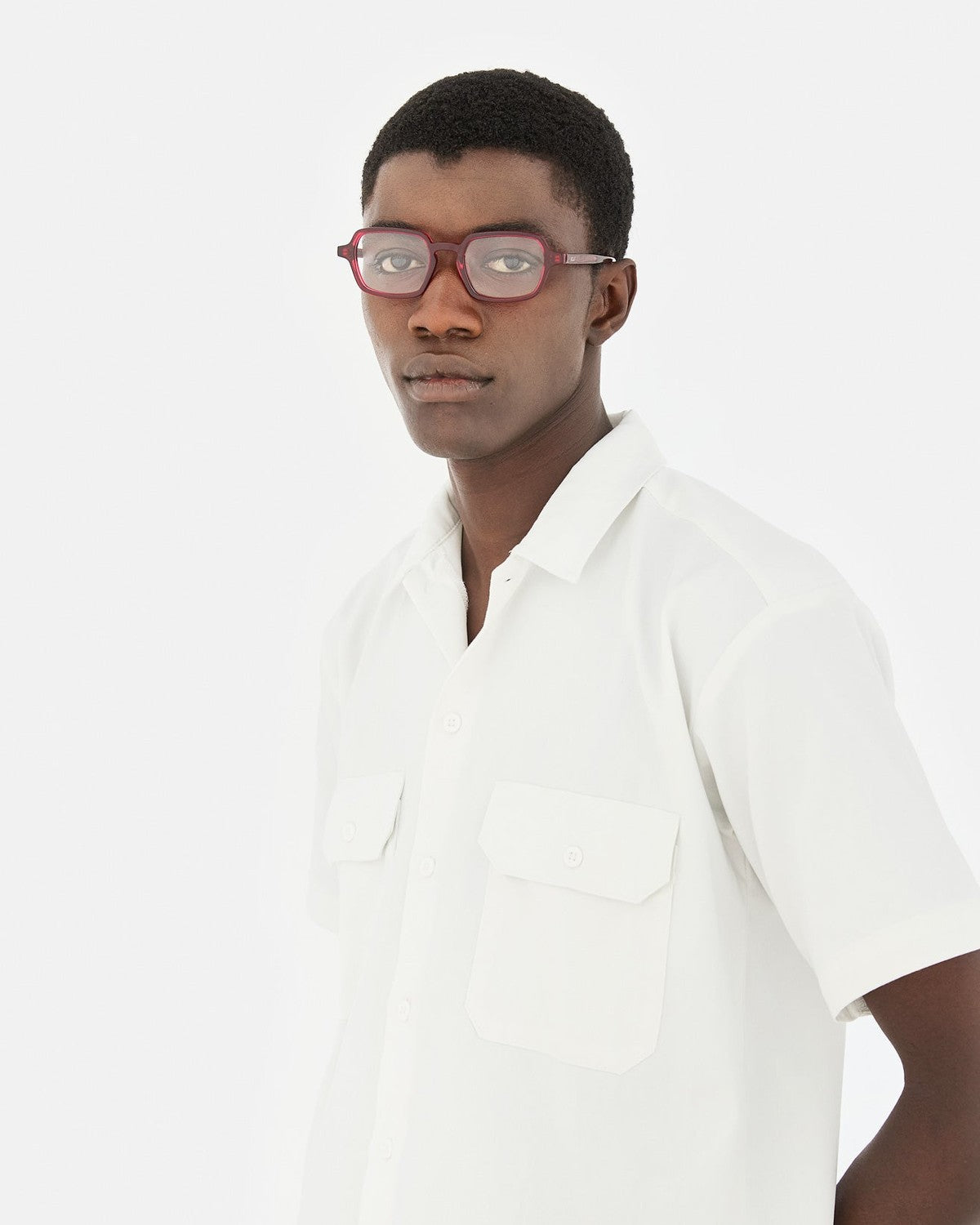 Model wearing RETROSUPERFUTURE Numero 141 Bordeaux sunglasses in side profile.