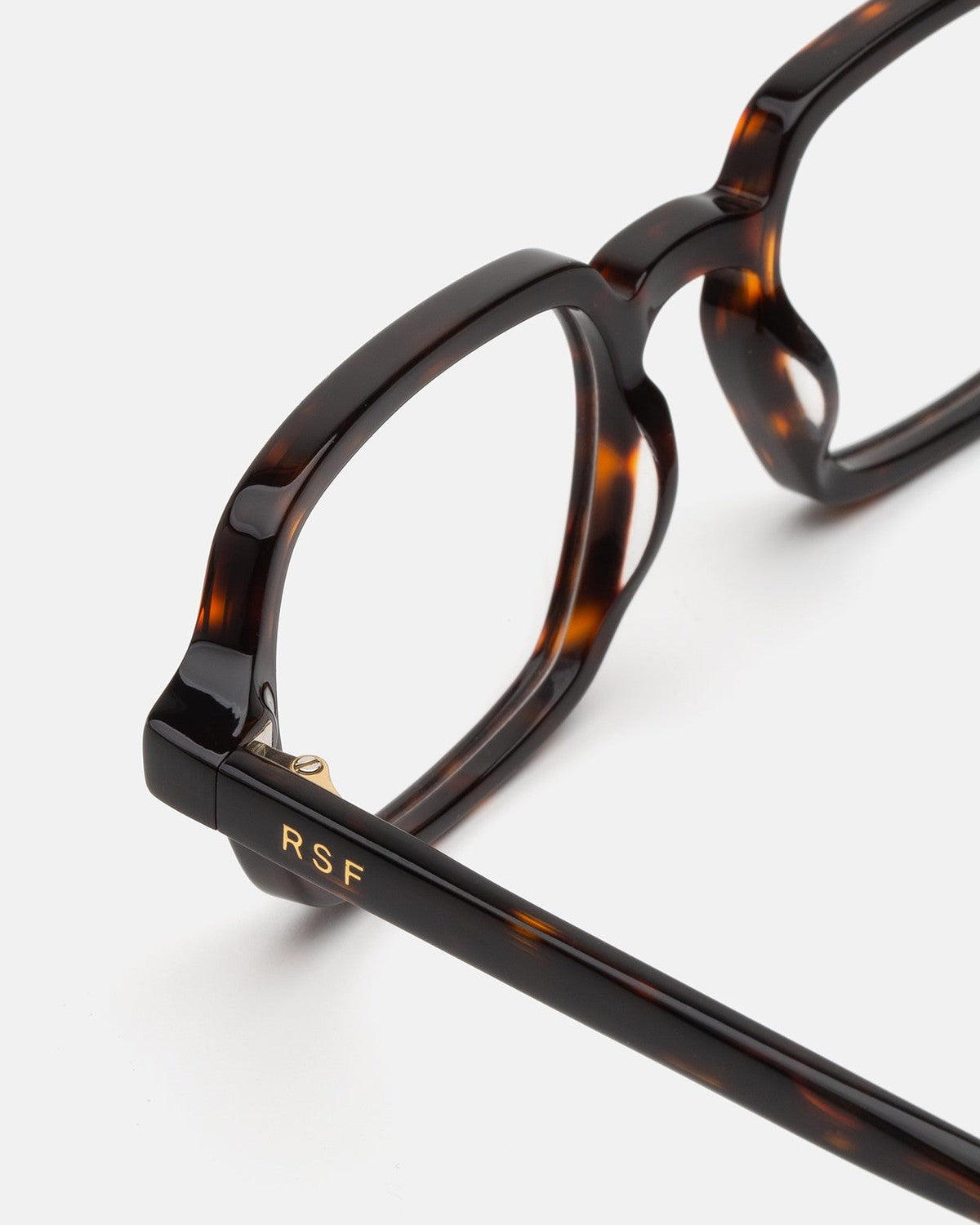Close-up of the temple hinge and RSF logo on RETROSUPERFUTURE Numero 141 Havana sunglasses.