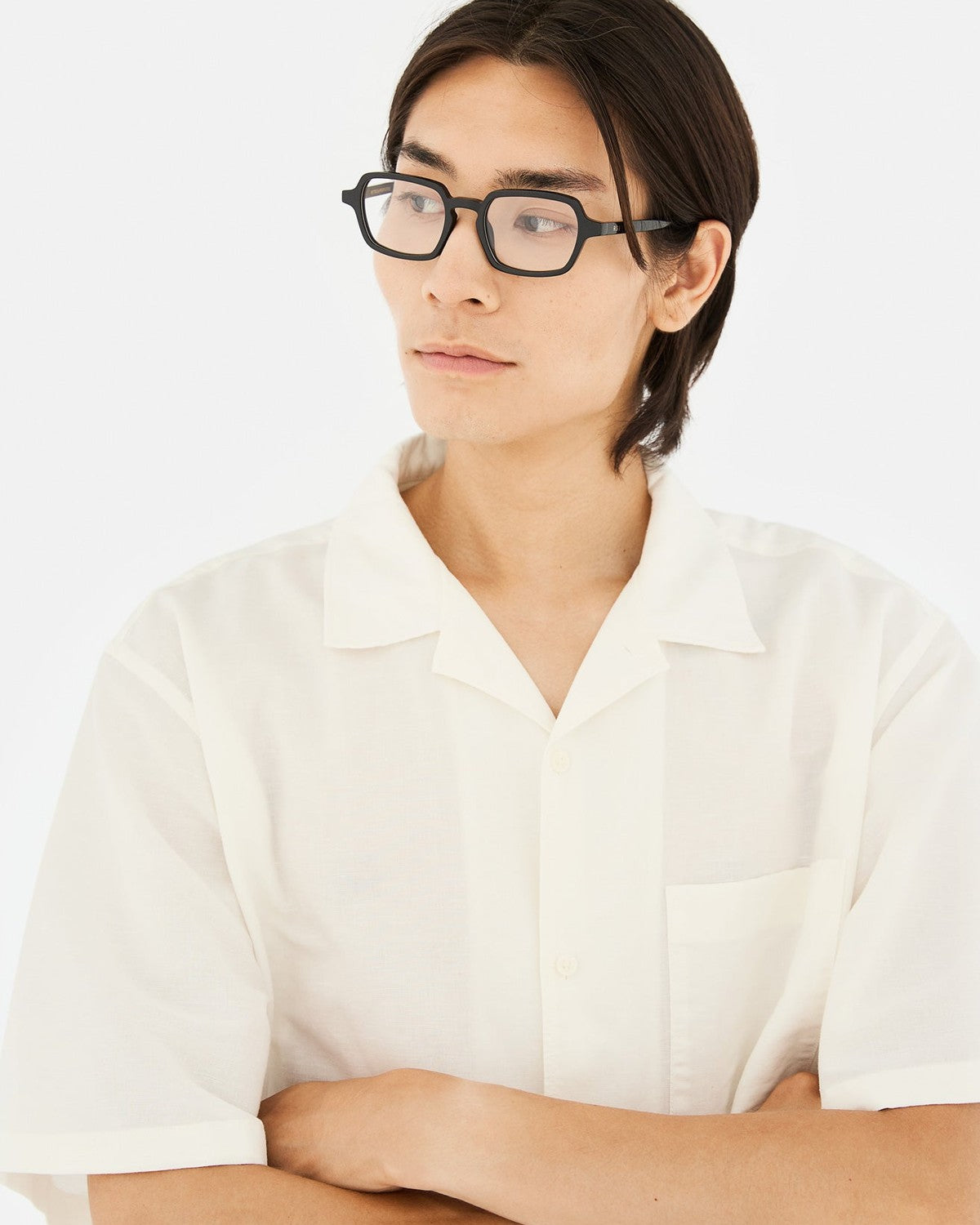 Model wearing RETROSUPERFUTURE Numero 141 Nero sunglasses with a white shirt.
