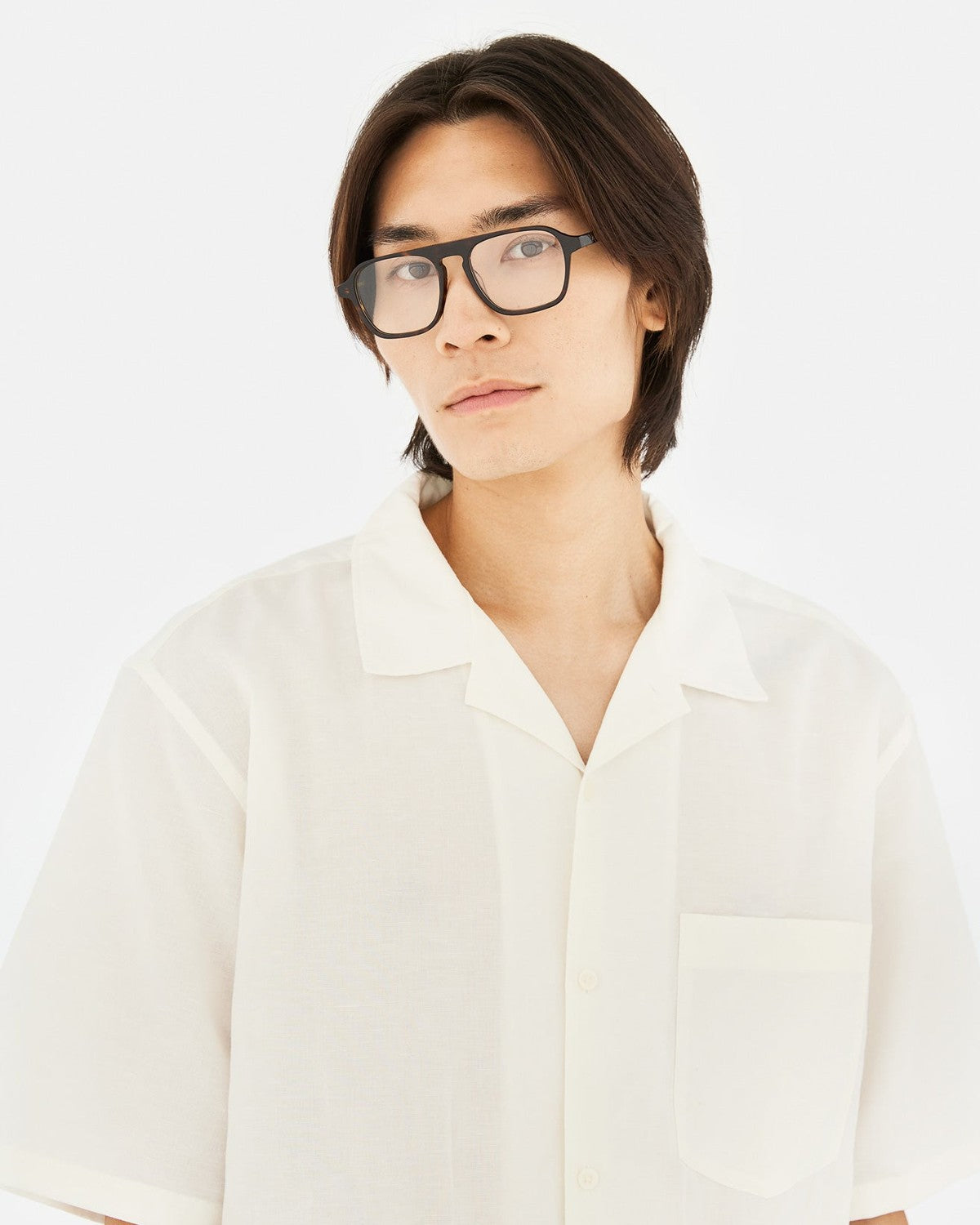 Model wearing RETROSUPERFUTURE Numero 142 Havana sunglasses in a white shirt.