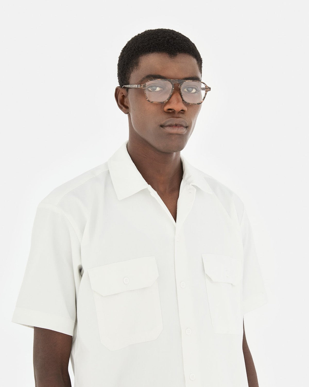 Model wearing RETROSUPERFUTURE Numero 142 Strambo sunglasses in portrait.