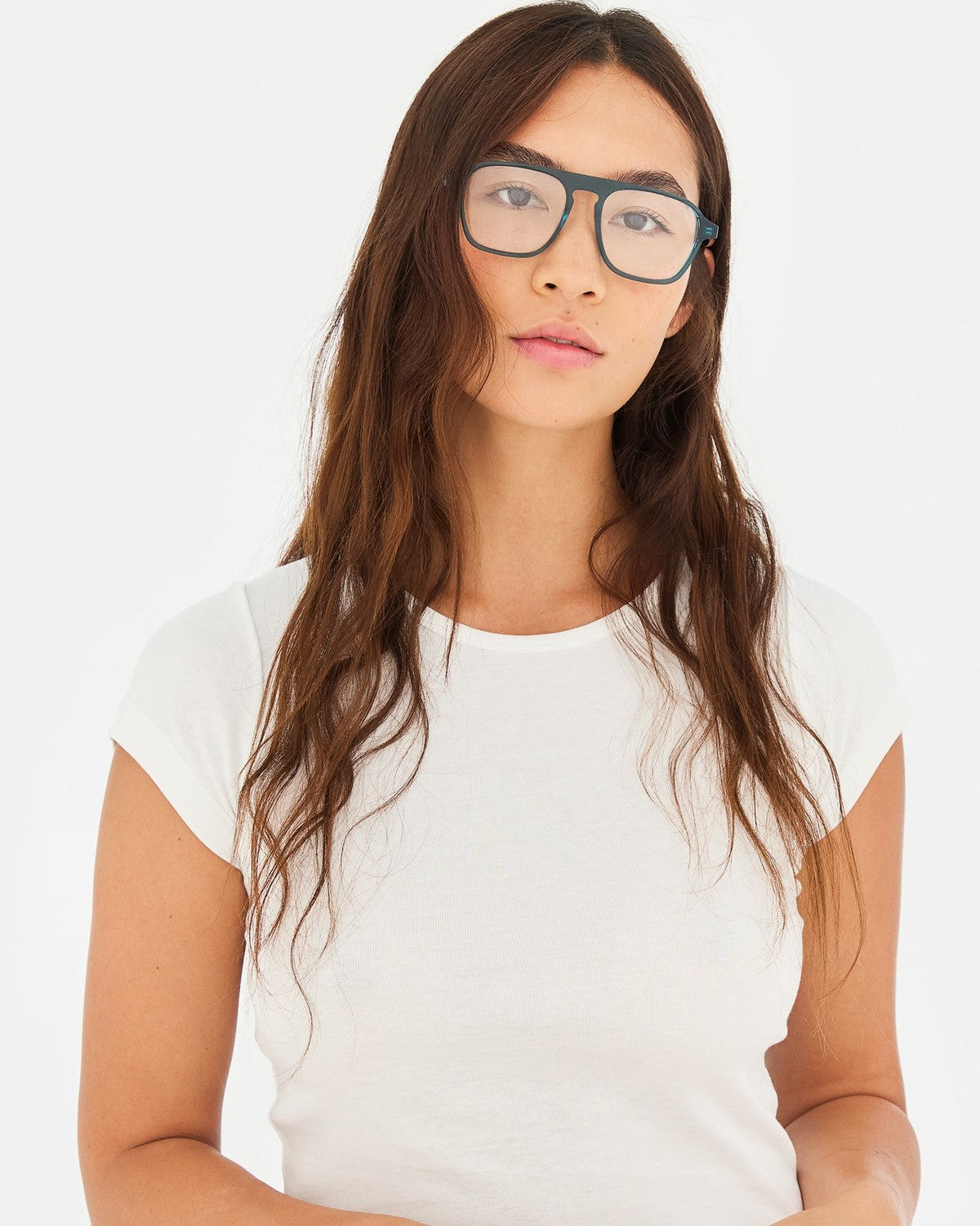Model wearing RETROSUPERFUTURE Numero 142 Teal sunglasses.