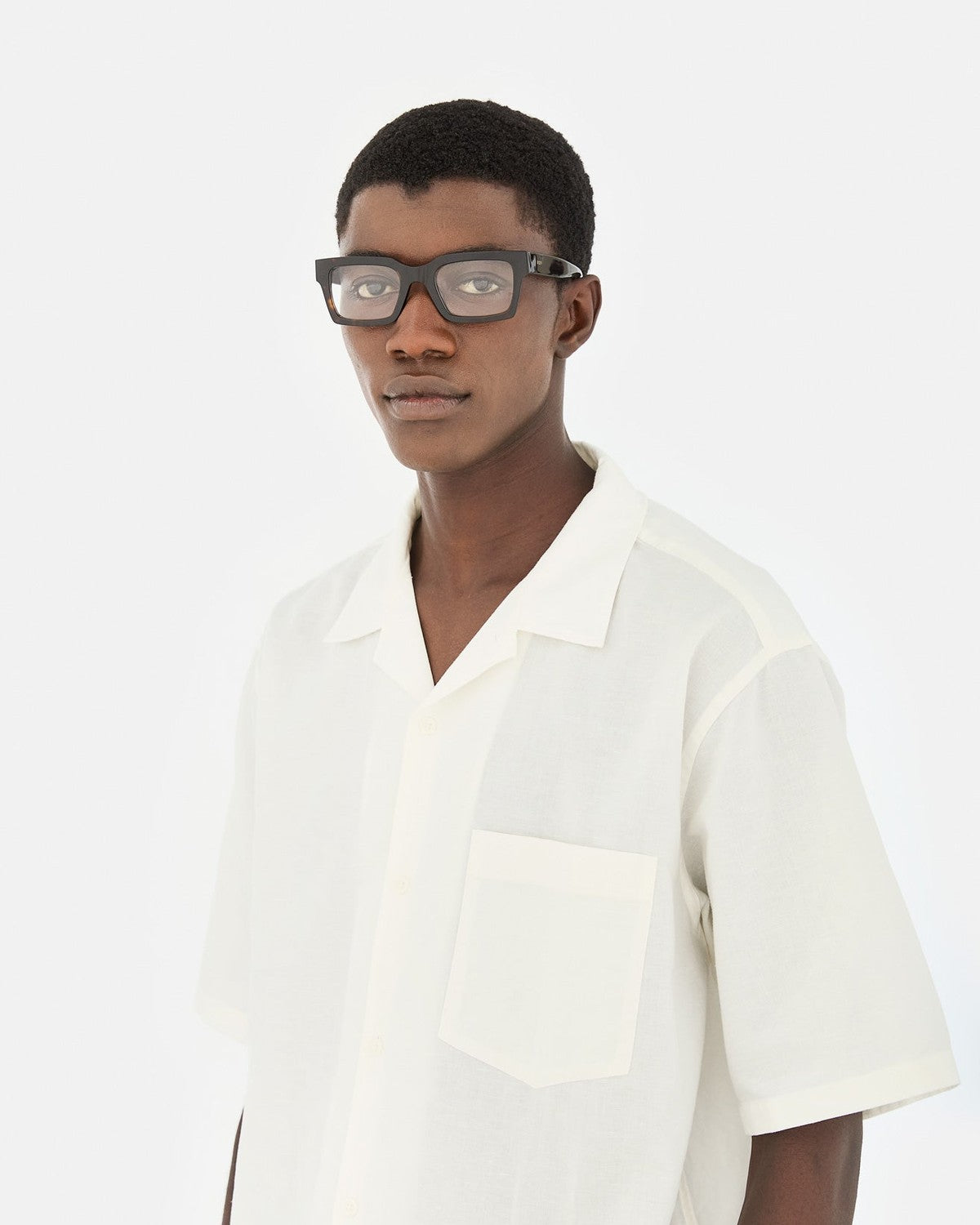 Model wearing RETROSUPERFUTURE Numero 144 Havana sunglasses in three-quarter view.