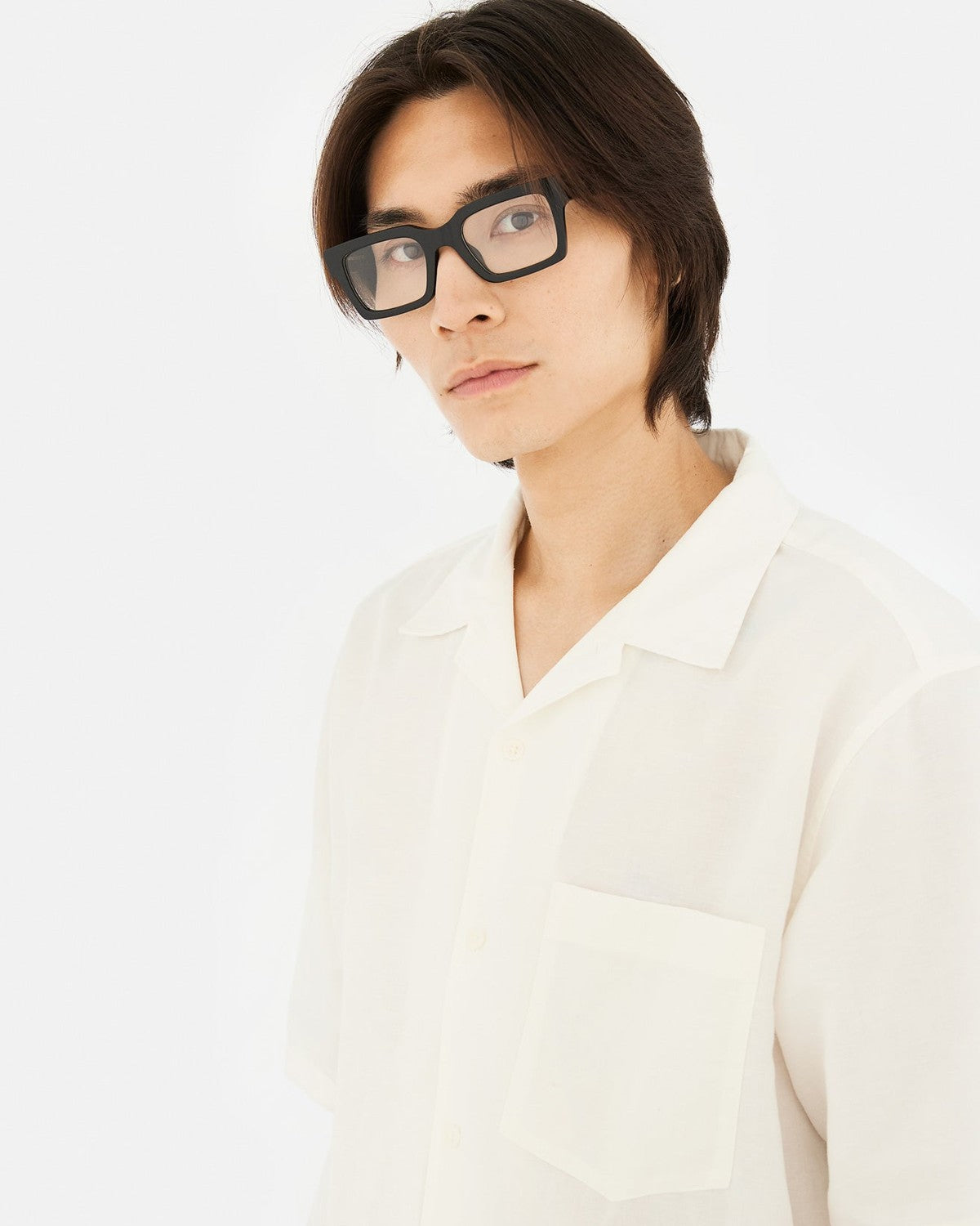 Model wearing RETROSUPERFUTURE Numero 144 Nero sunglasses with white shirt.