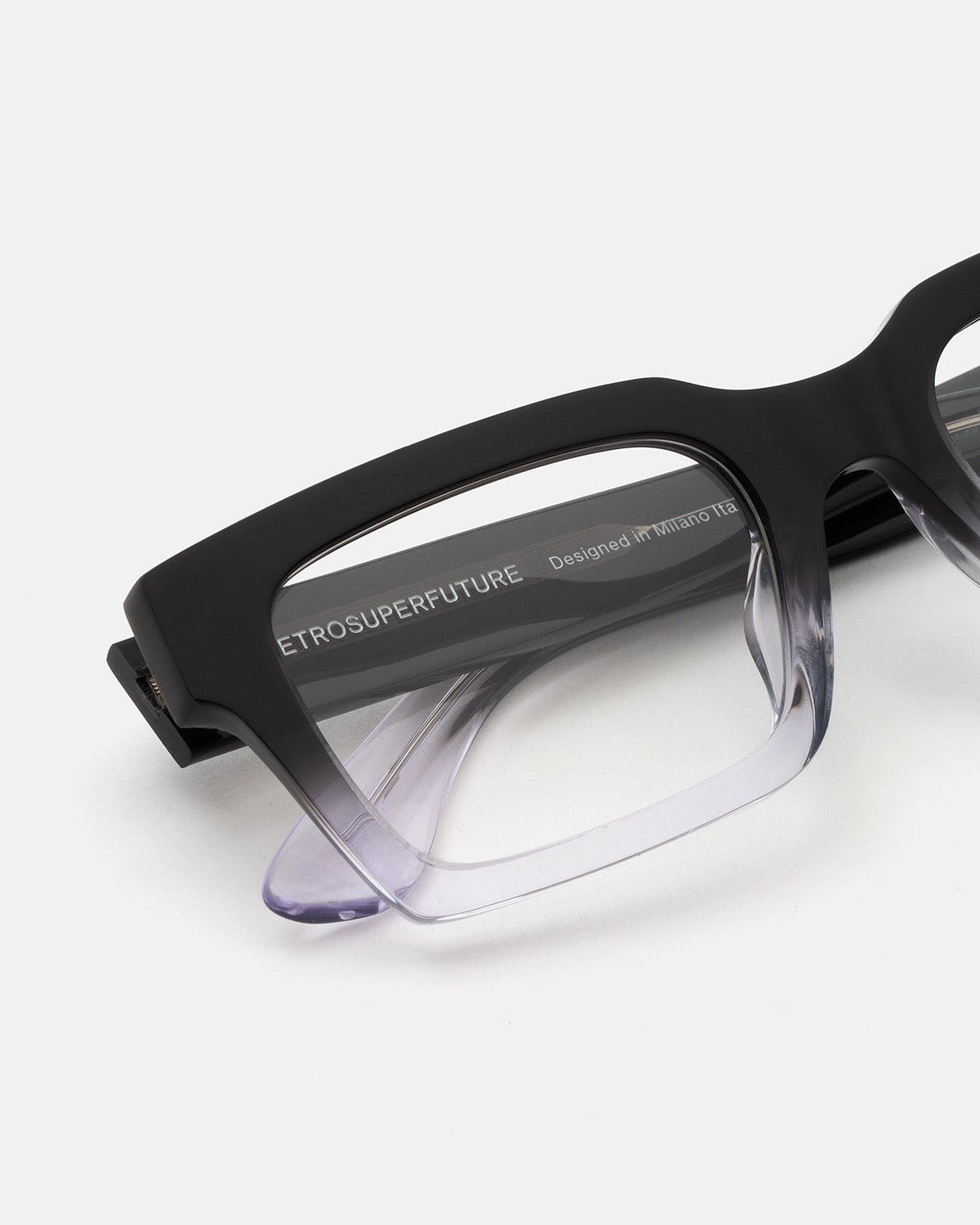 Close-up of the temple and gradient fade on RETROSUPERFUTURE Numero 144 Nero Sfumato sunglasses.