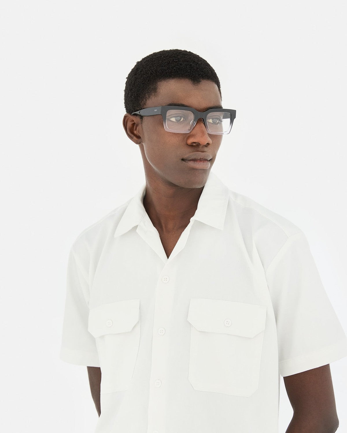 Model wearing RETROSUPERFUTURE Numero 144 Nero Sfumato sunglasses in angle view.