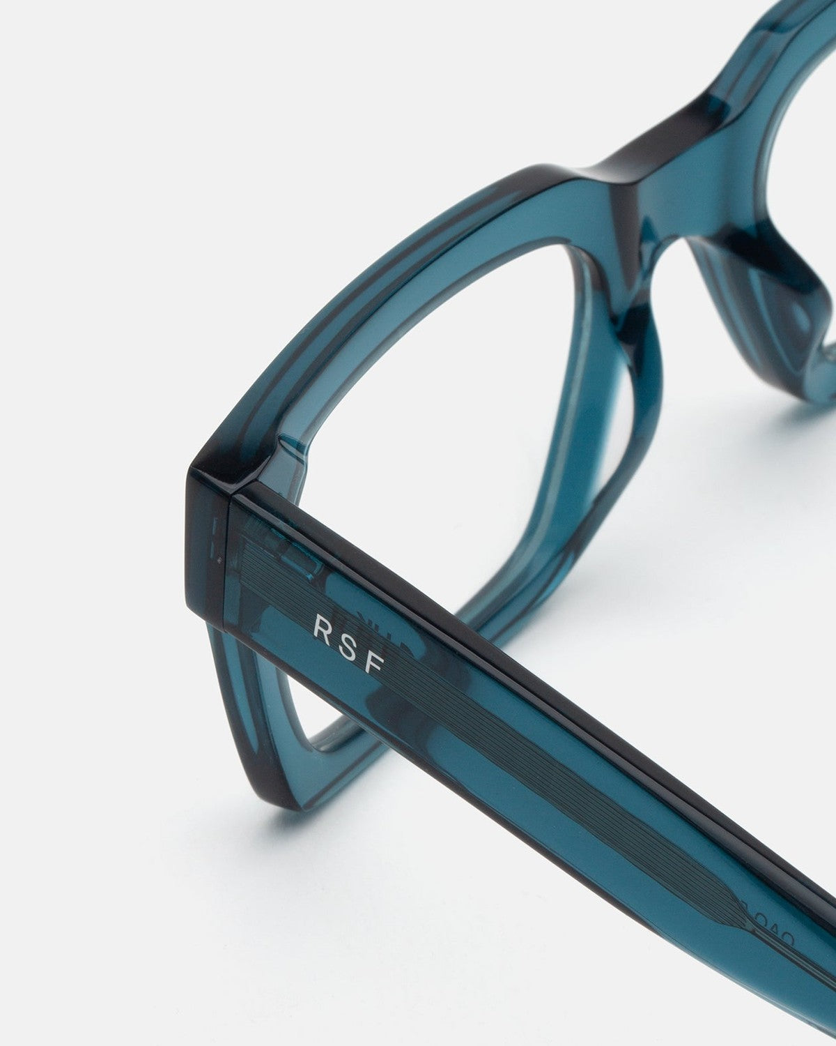Close-up of the temple and hinge on RETROSUPERFUTURE Numero 144 Teal sunglasses.