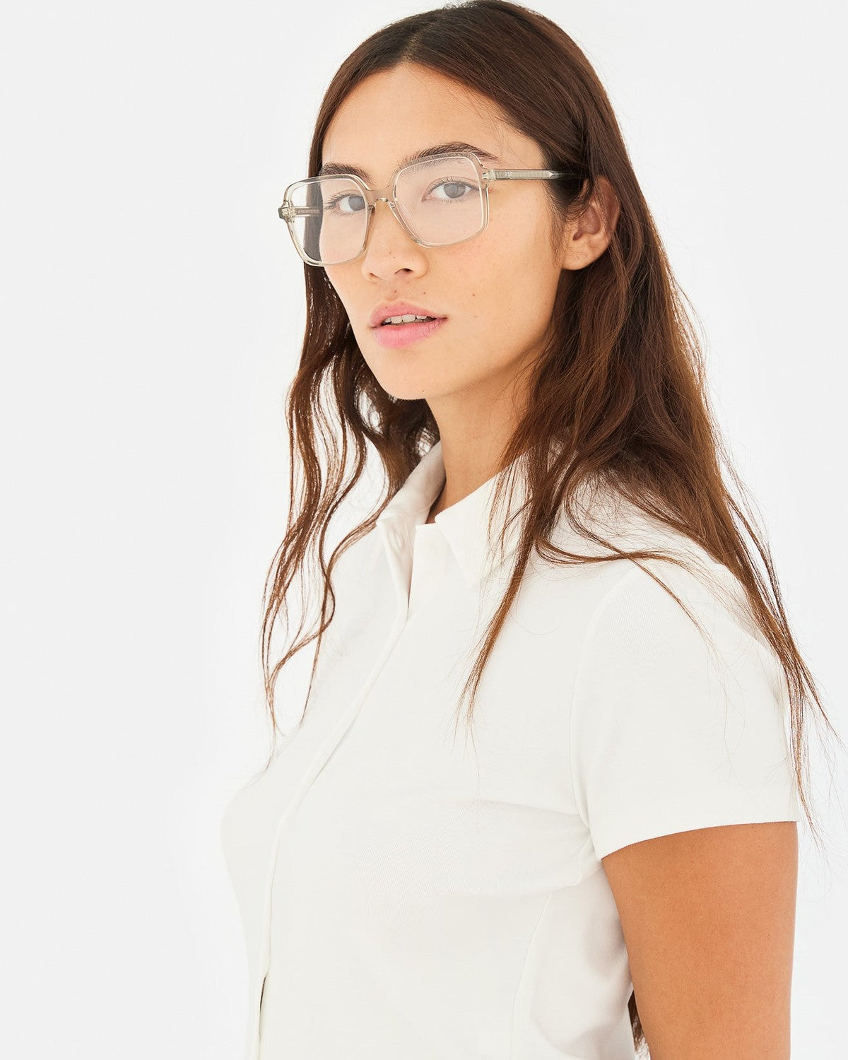 Model wearing RETROSUPERFUTURE Numero 149 Nebbia sunglasses in a three-quarter view.