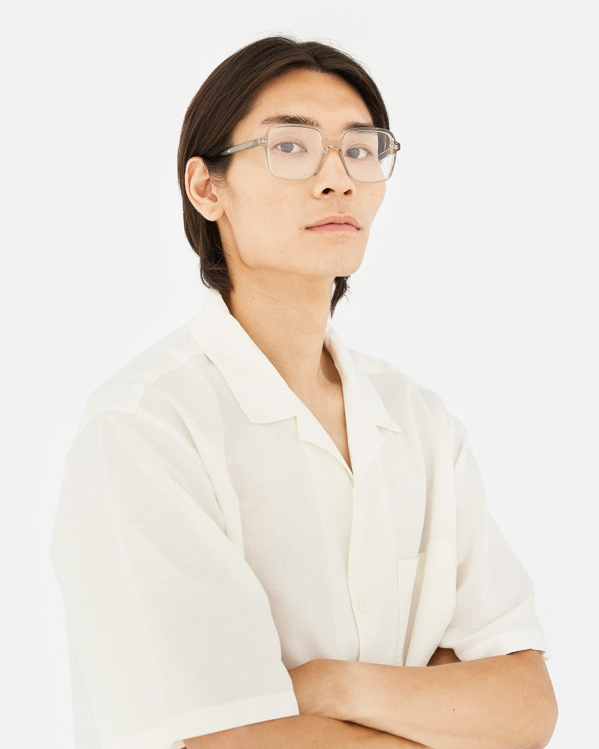 Model wearing RETROSUPERFUTURE Numero 149 Nebbia sunglasses looking upward.