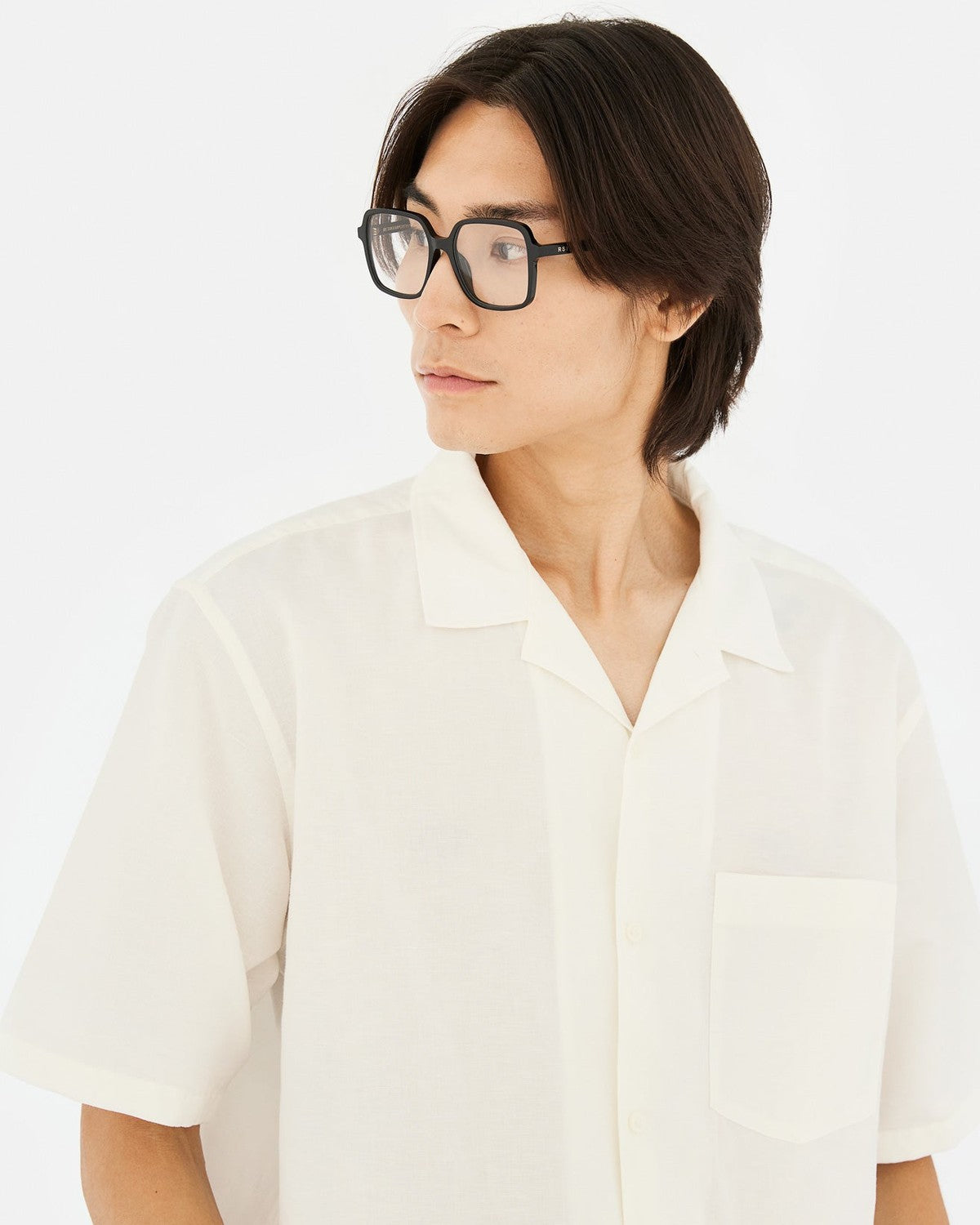 Model wearing RETROSUPERFUTURE Numero 149 Nero sunglasses with white shirt.