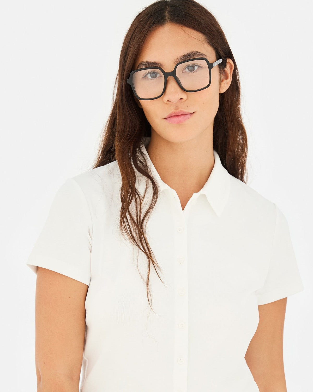 Model in white shirt wearing RETROSUPERFUTURE Numero 149 Nero sunglasses.